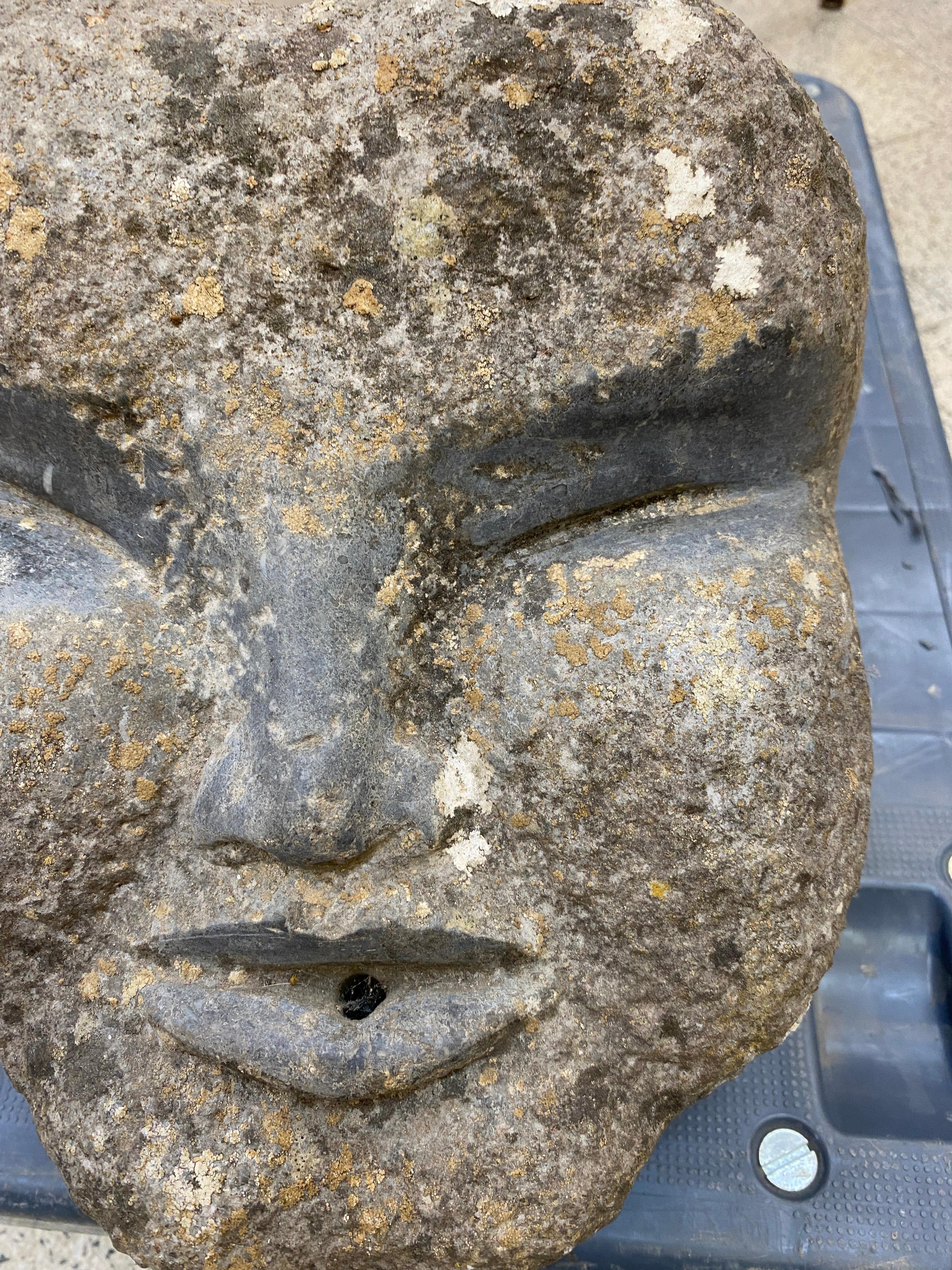 Primitive carved stone fountain head
Heavy.