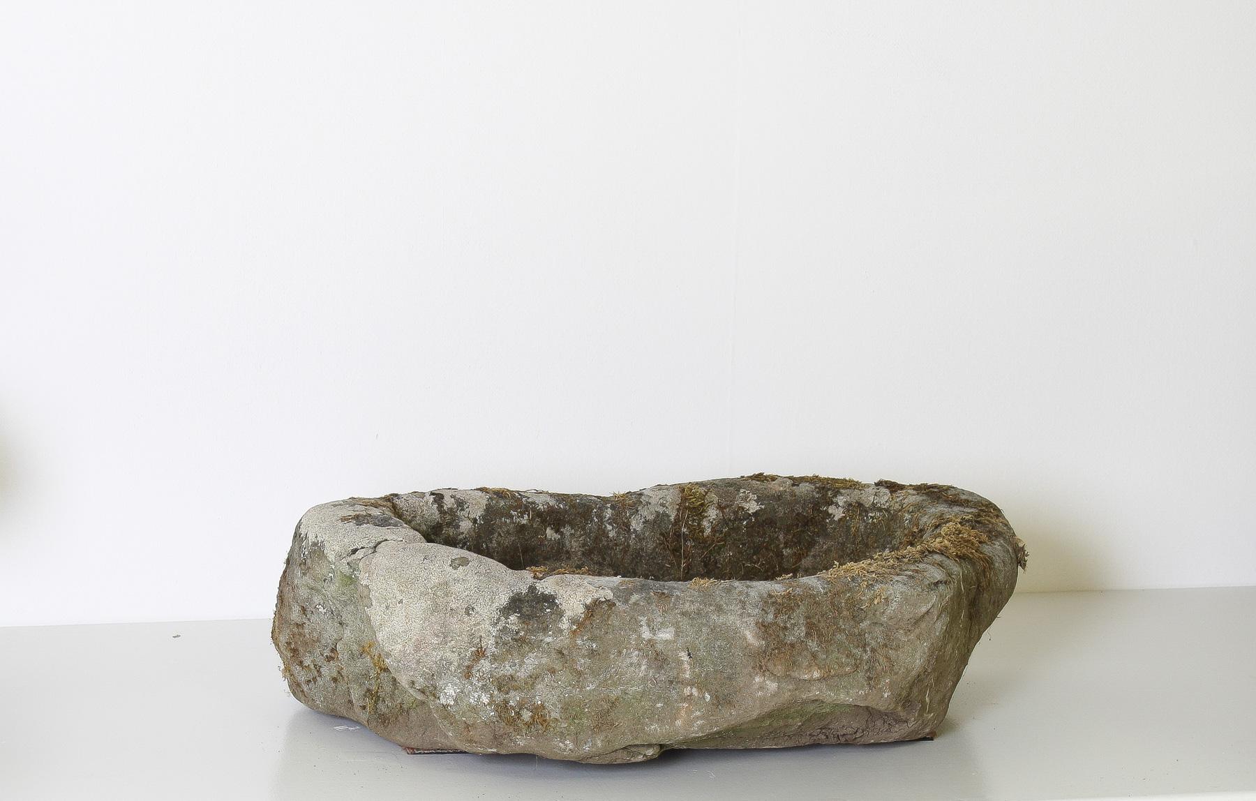 Step back in time with this one-of-a-kind primitive stone planter, crafted from rugged sandstone, it would have originally been carved as a drinking trough, dating back to the early part of the 19th century, possibly earlier. The irregular, organic