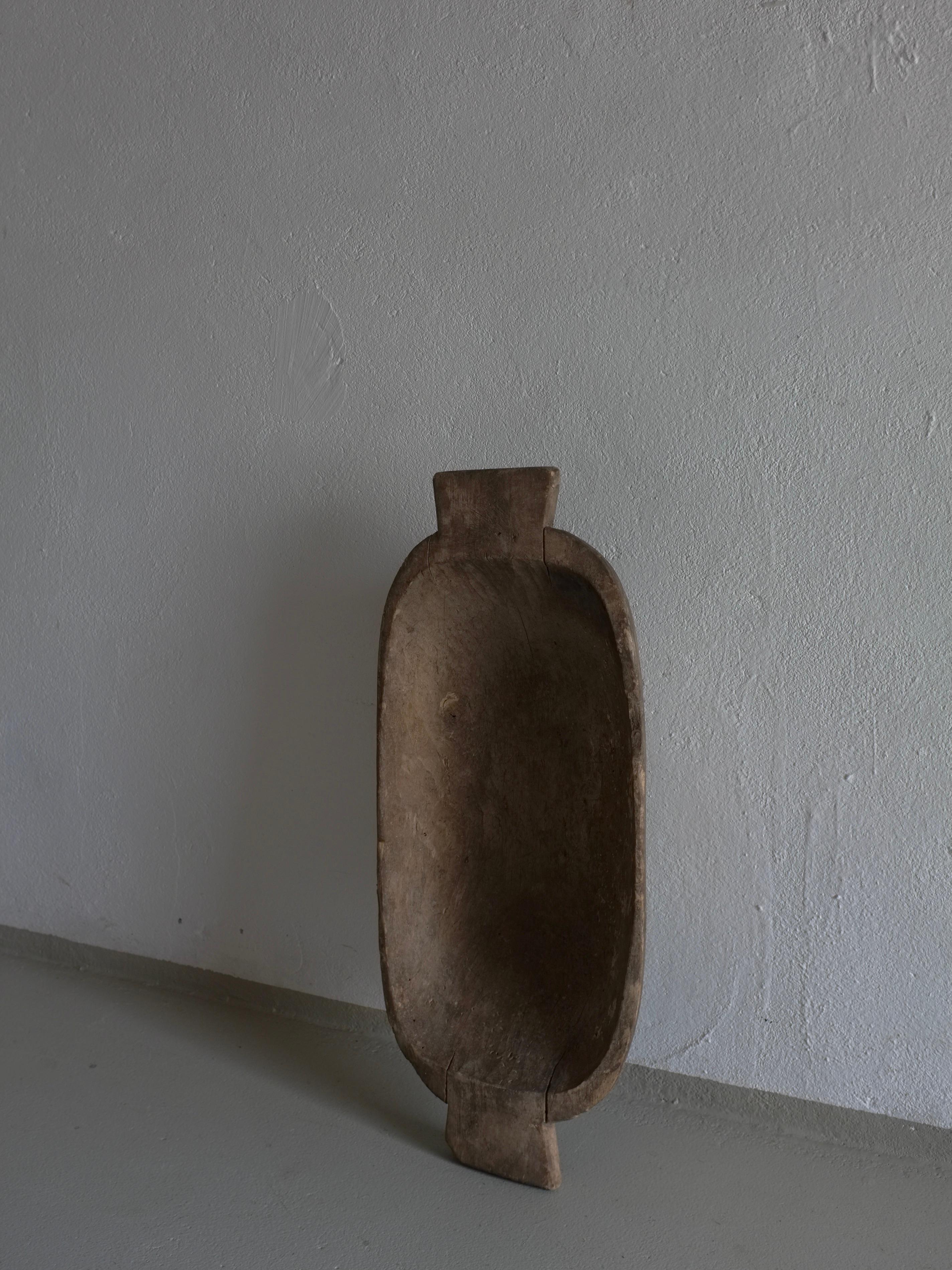 Antique primitive carved wooden bowl (#1) with a beautiful patina.

Additional information:
Origin: Latvia
Dimensions: W 65 cm x D 28 cm x H 10.5 cm 