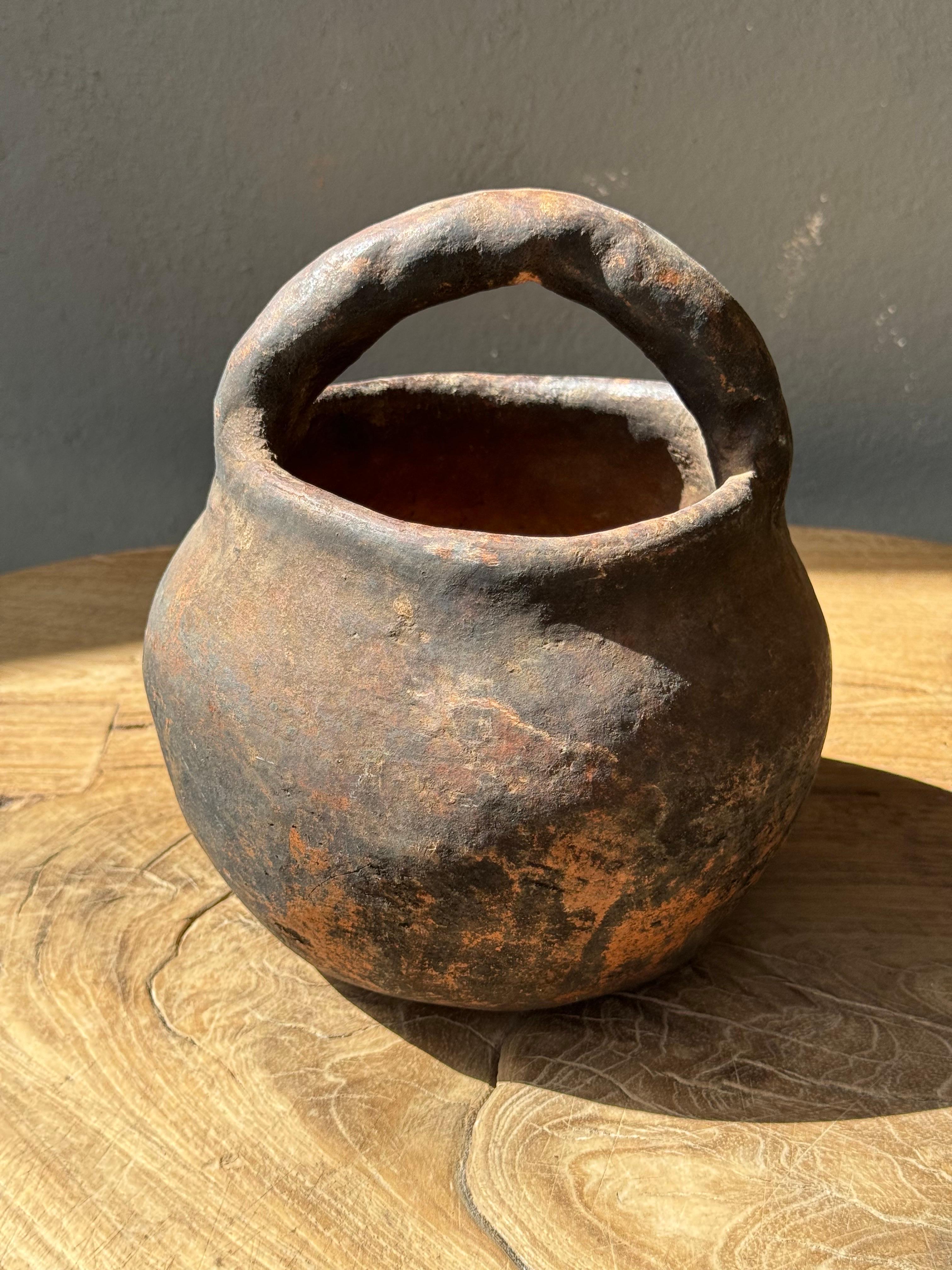Primitive clay seed bowl with handle from the Mixteca region of Oaxaca, circa 1950´s.