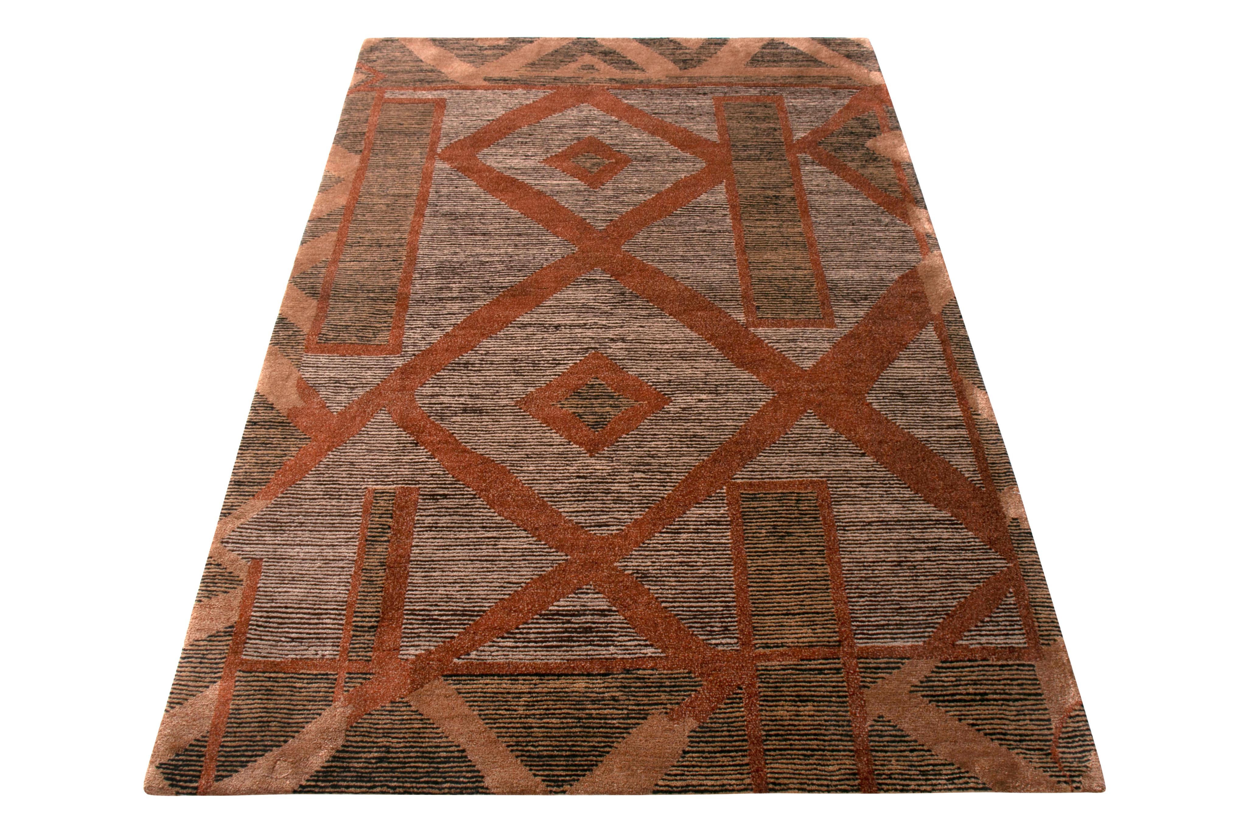 Hand knotted in wool and silk, this 4 x 6 rug from the New & Modern Collection by Rug & Kilim draws inspiration from primitive cubist patterns with a modern color perspective; an array of lustrous gray, beige-brown, and pink colorway hues all