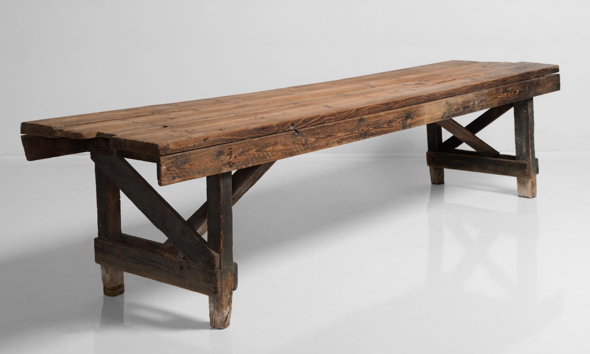 Primitive dining table, France, 19th century.

Rustic construction with substantial supports, plank top and amazing patina.