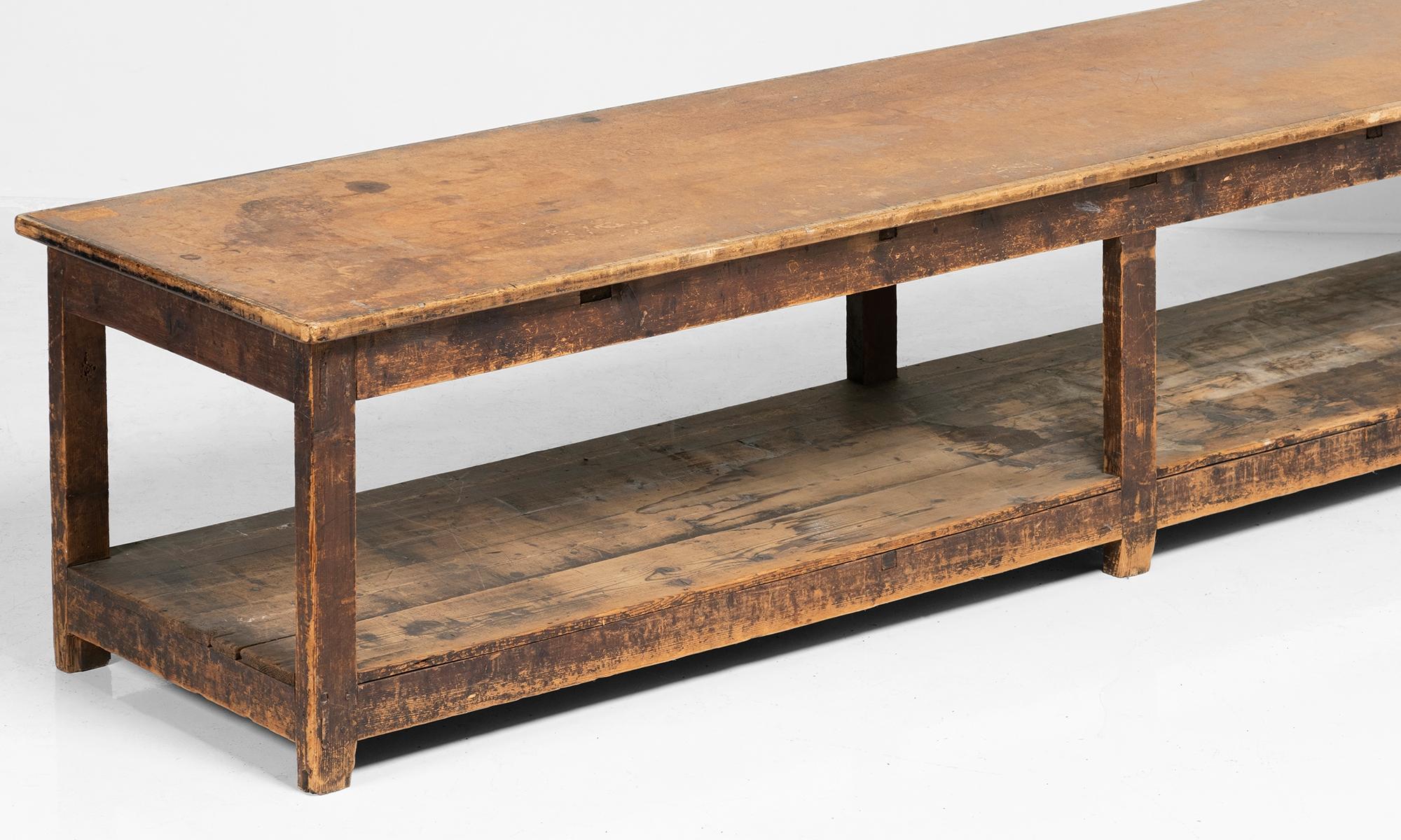 Massive work table constructed in pine with composite wood top.