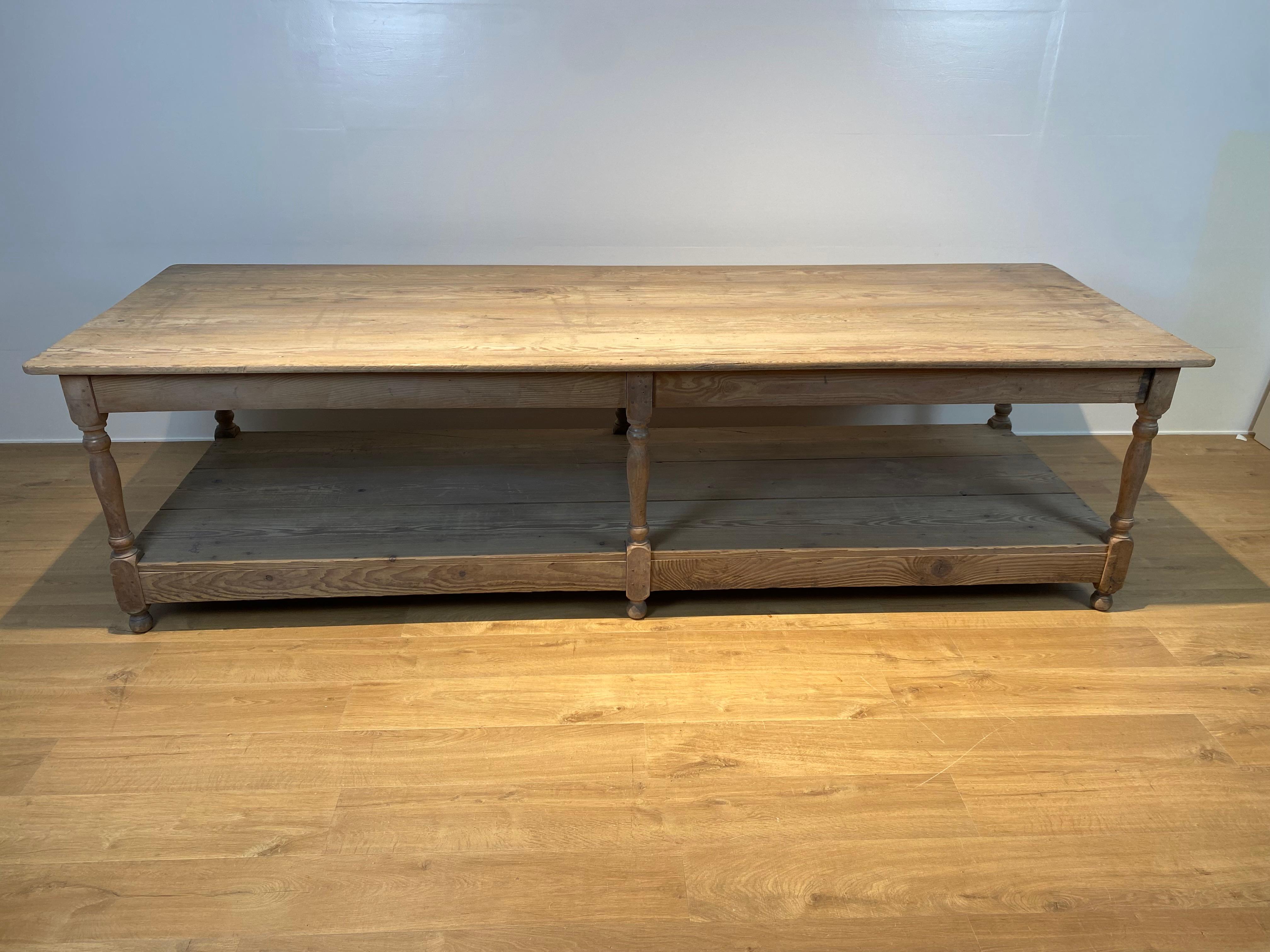 Elegant and primitive French Drapiers Table in bleached Pine Wood,
France from around 1900,
warm patina and shine of the Pine Wood,
simple but strong design of the table,
the table can be used for different purposes, as a console or as a center
