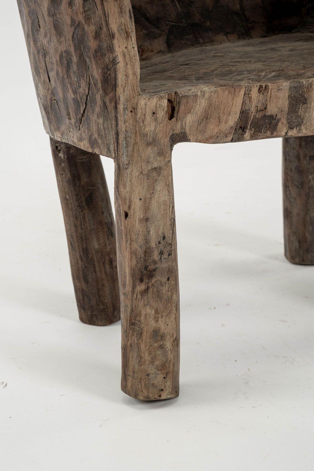 Primitive dug-out chair from Southeast Asia. Hand-carved from sold piece of hardwood.

Note: Regional differences in humidity and climate during shipping may cause antique and vintage wood to shrink and/or split along its grain, veneer to loosen