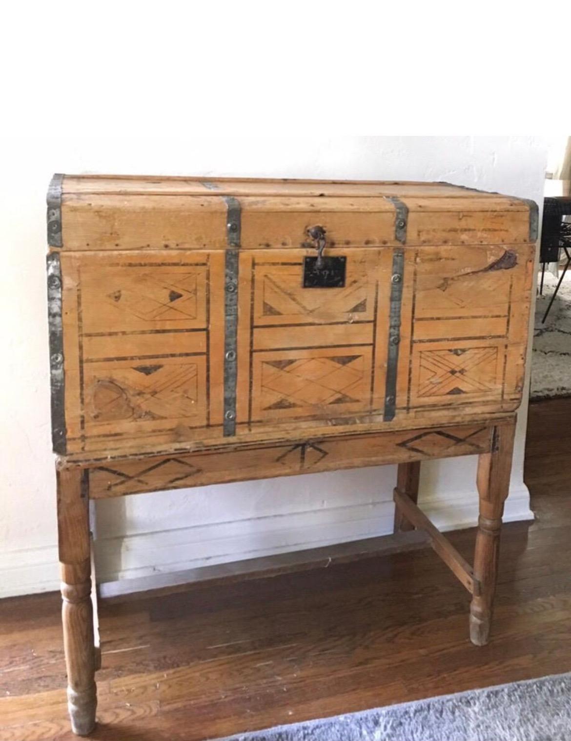 Early/Primitive hand-painted chest with tons of character. Stamped Mexico on the bottom.
Shows wear and tear consistent with age. Iron hinge with key hole (does not have the key). Stands on four legs.
Spanish/Folk Art style with beautiful bright