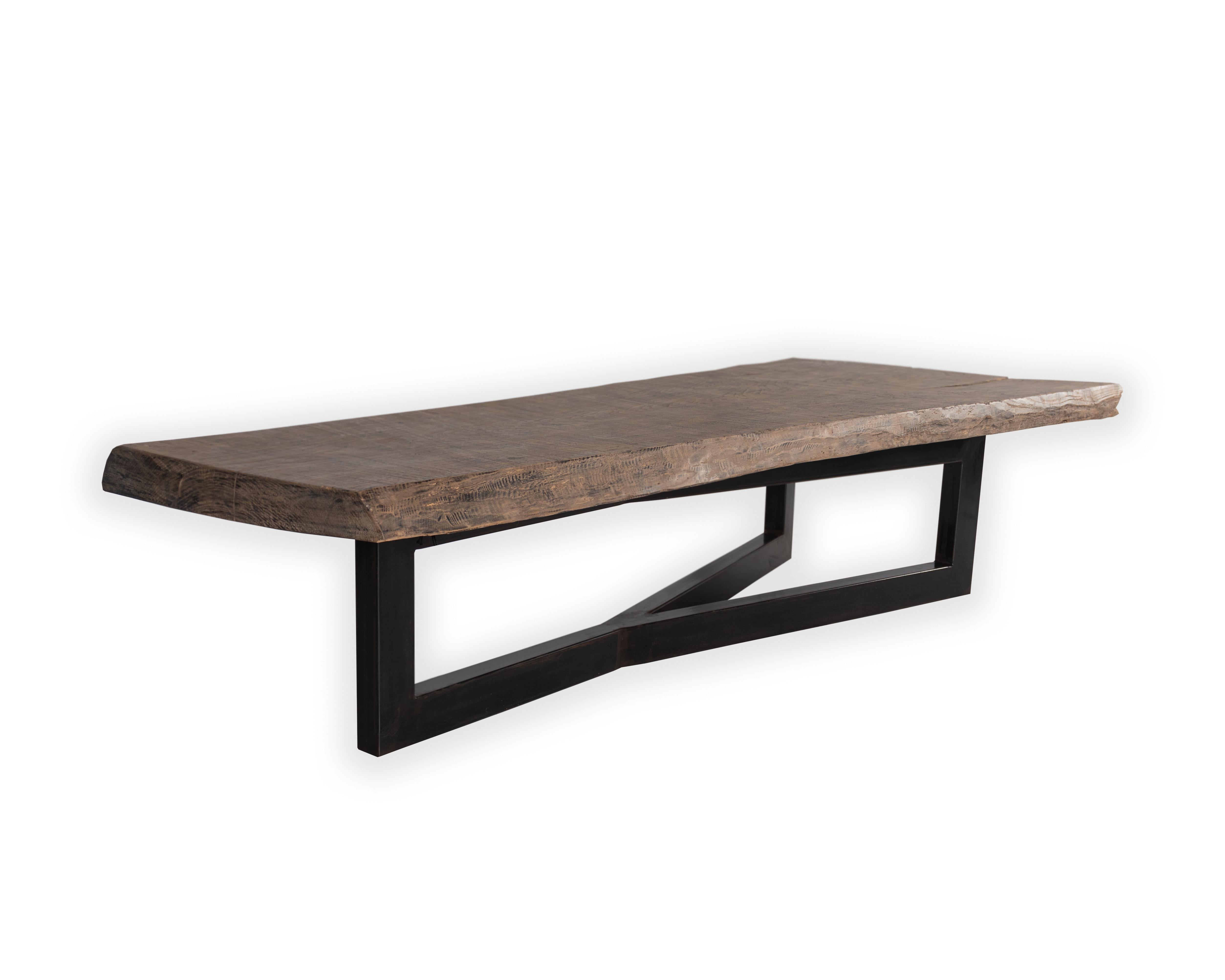 Primitive elm slab wood top with geometric pronged steel mount coffee table. 

Piece from the Le Monde collection. Exclusive to Brendan Bass. 
 