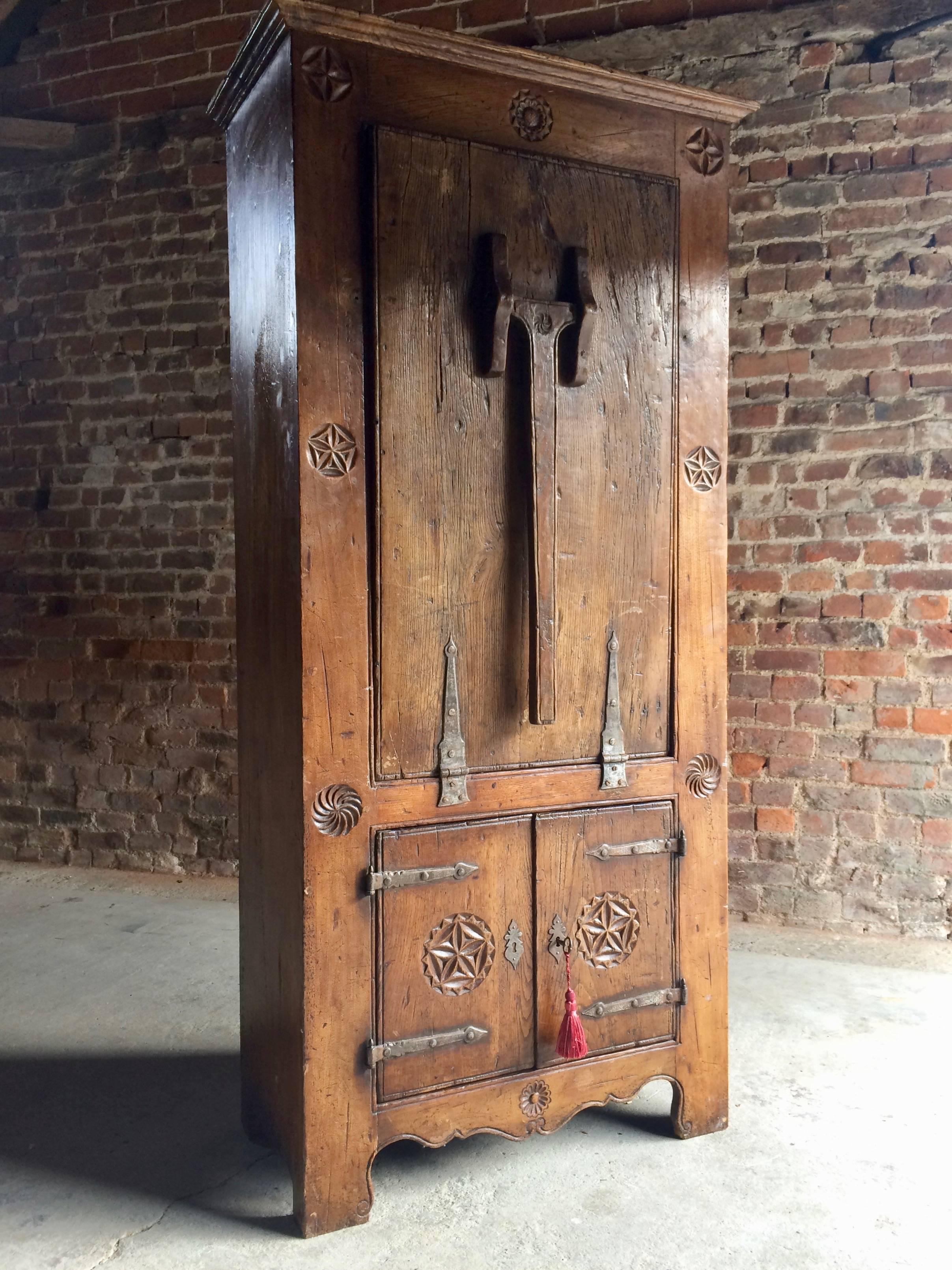 Rare 16th century Dutch solid oak cupboard featuring a drop-down farmhouse table, the corniced top over a single drop down door with original hand forged iron hinges, the door with a single swing down leg that drops down to form a table, two shelves