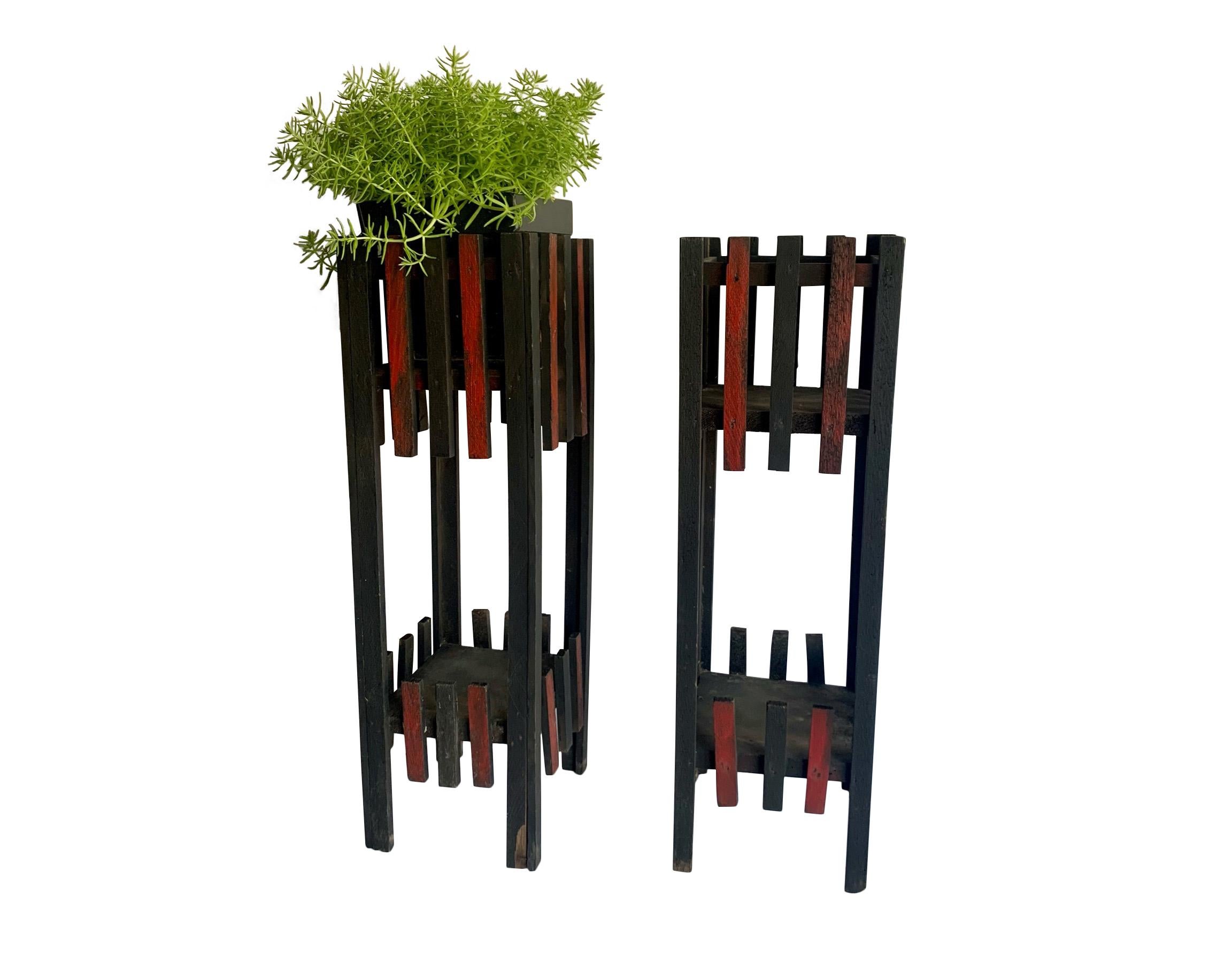 Charming pair of homemade wood plant stands with great folk art vibes. Two shelves on each for plants -- or whatever you would like to display. Would be a lovely home for a fern or trailing ivy. Red highlights are on two of the four sides on each.