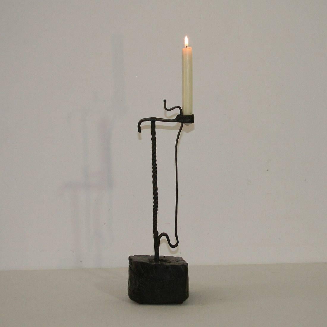 Beautiful primitive wrought iron candleholder, France, circa 1650-1750. Weathered, small losses.