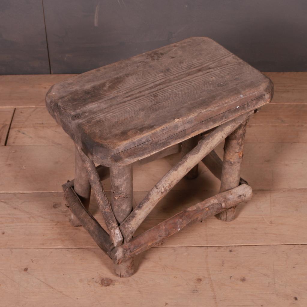19th C primitive French stool. 1890.

Dimensions
19.5 inches (50 cms) wide
13 inches (33 cms) deep
18.5 inches (47 cms) high.