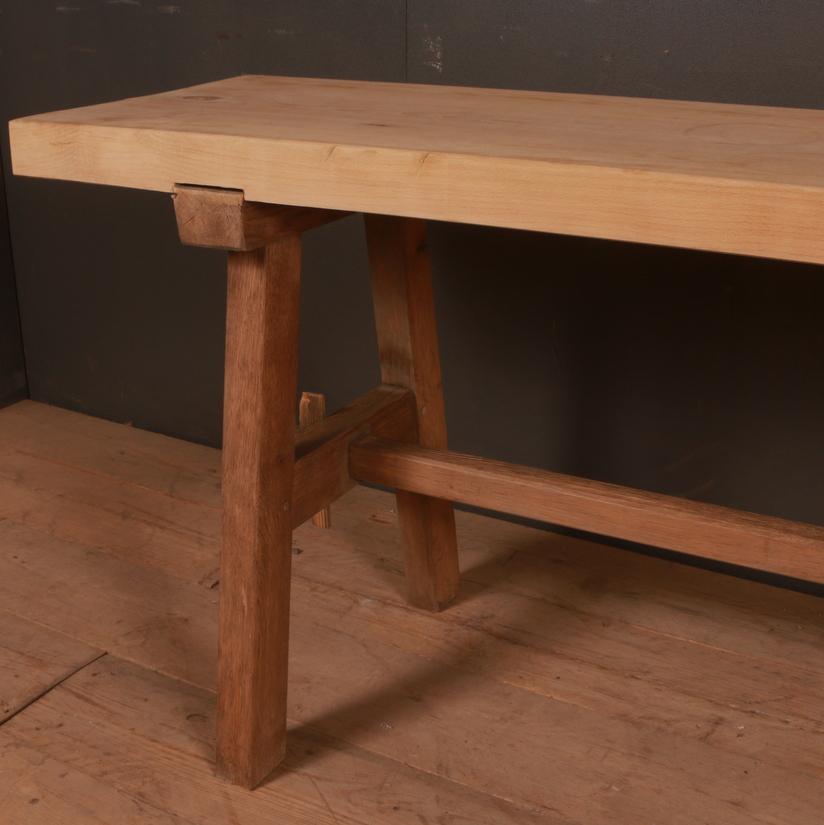 19th century primitive French oak and sycamore trestle table, 1840.

Dimensions:
71.5 inches (182 cms) wide
19 inches (48 cms) deep
30.5 inches (77 cms) high.

               