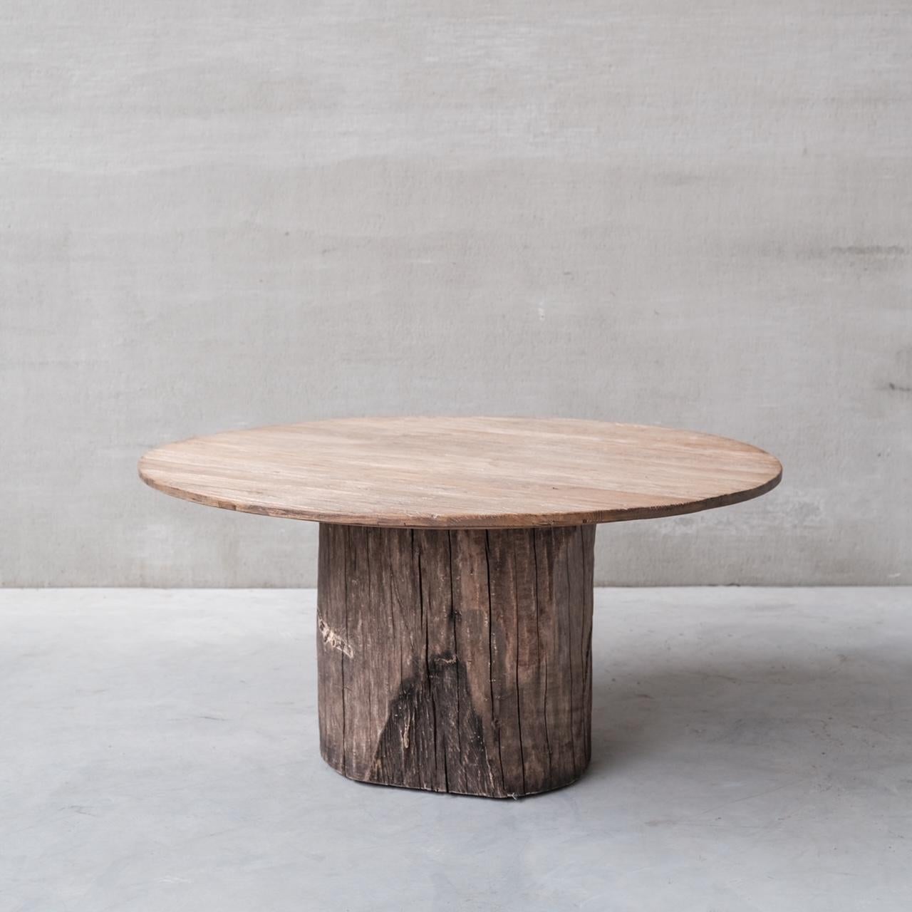 A large primitive style dining table. 

A large chunky tree trunk base paired with an elegant top. 

France, c1970s. 

6-8 seater. Good vintage condition. 

Larger than the photos suggest so do measure up. 

Location: Belgium Gallery.

Dimensions: