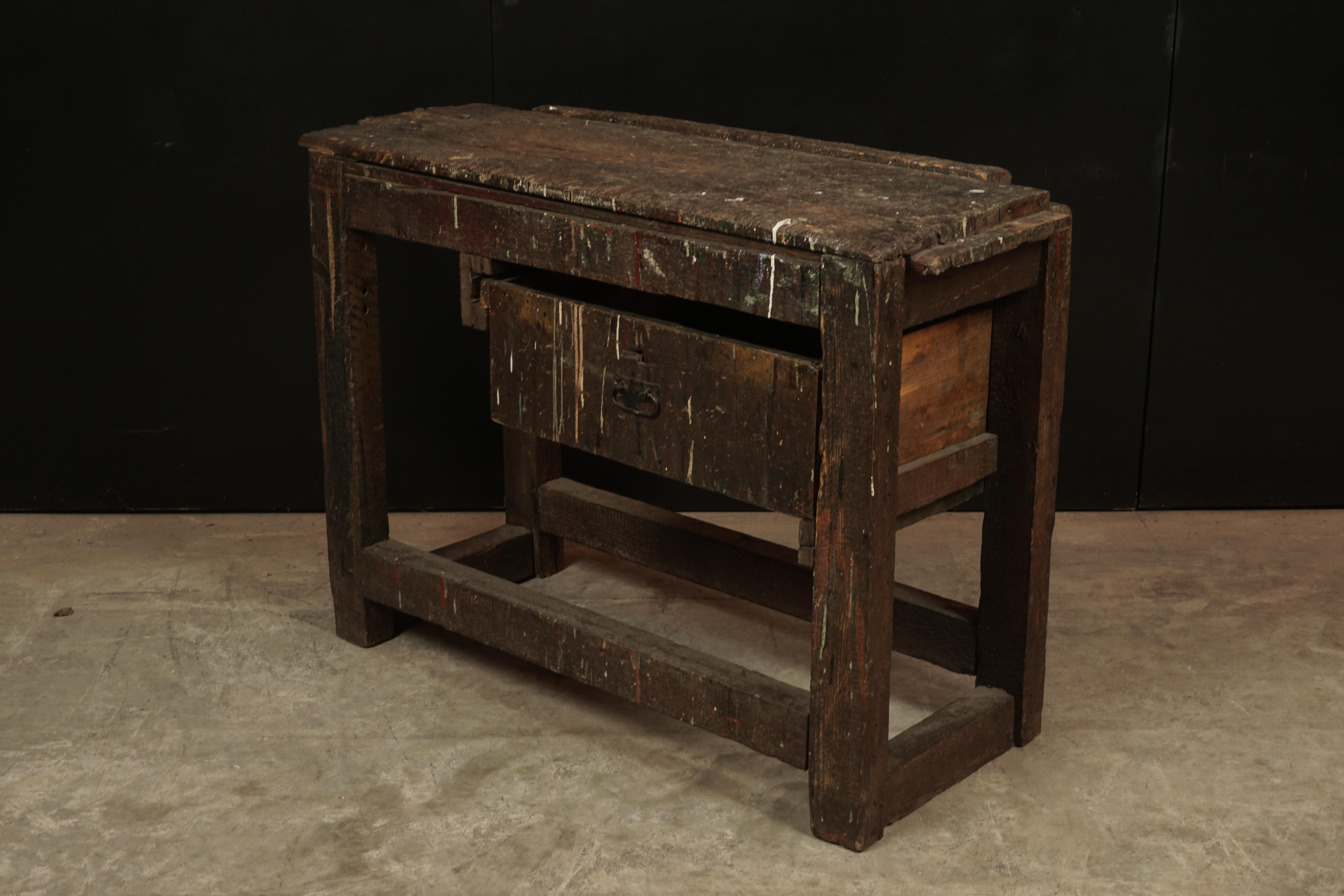 Primitive French work console table from France, circa 1940. Solid pine construction with original hardware. Fantastic patina and wear.