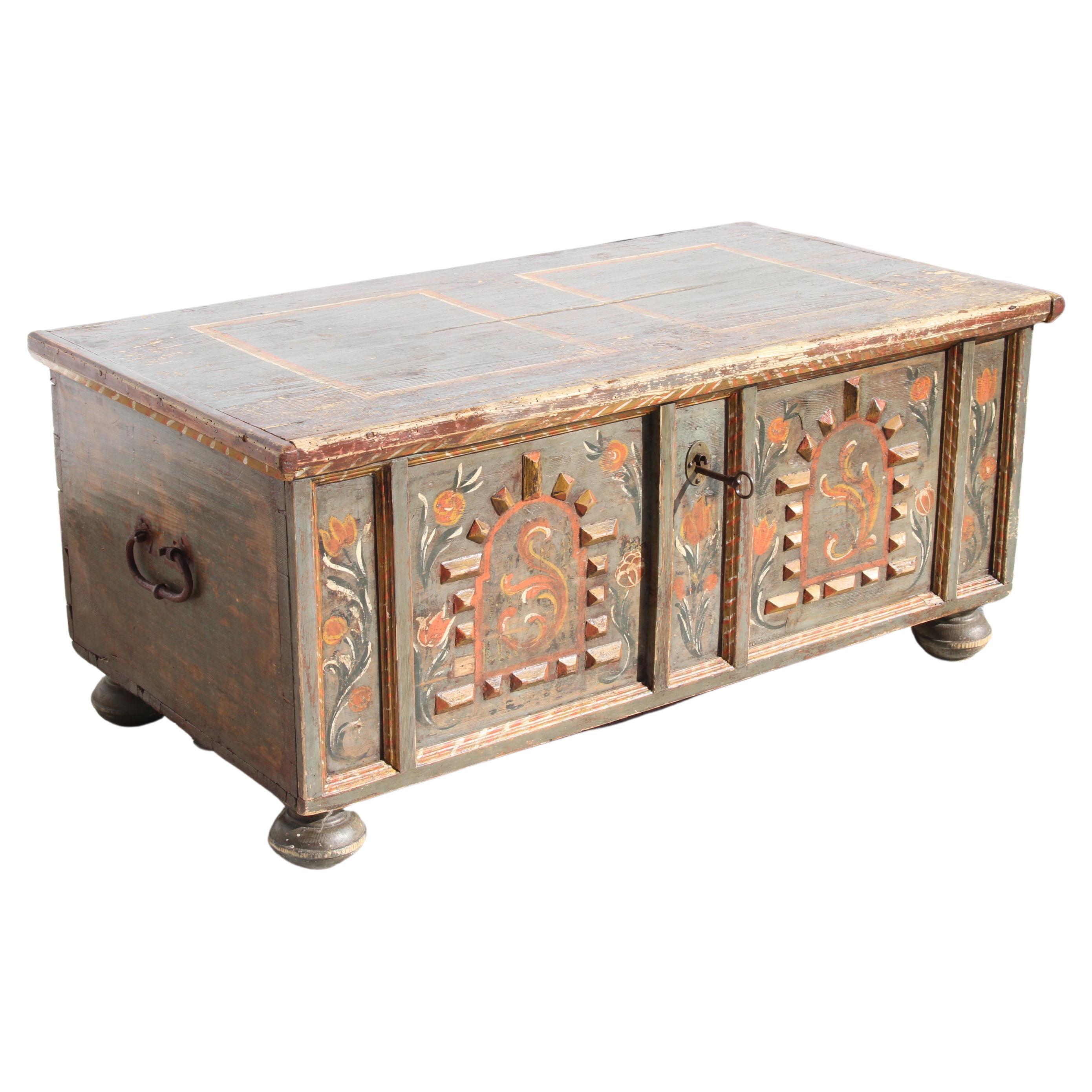 Primitive hand carved Bridal chest


European primitive trunk with floral details and wood appliques. 
Key opens to a to reveal a deep storage. Bun feet. Keyed lock.