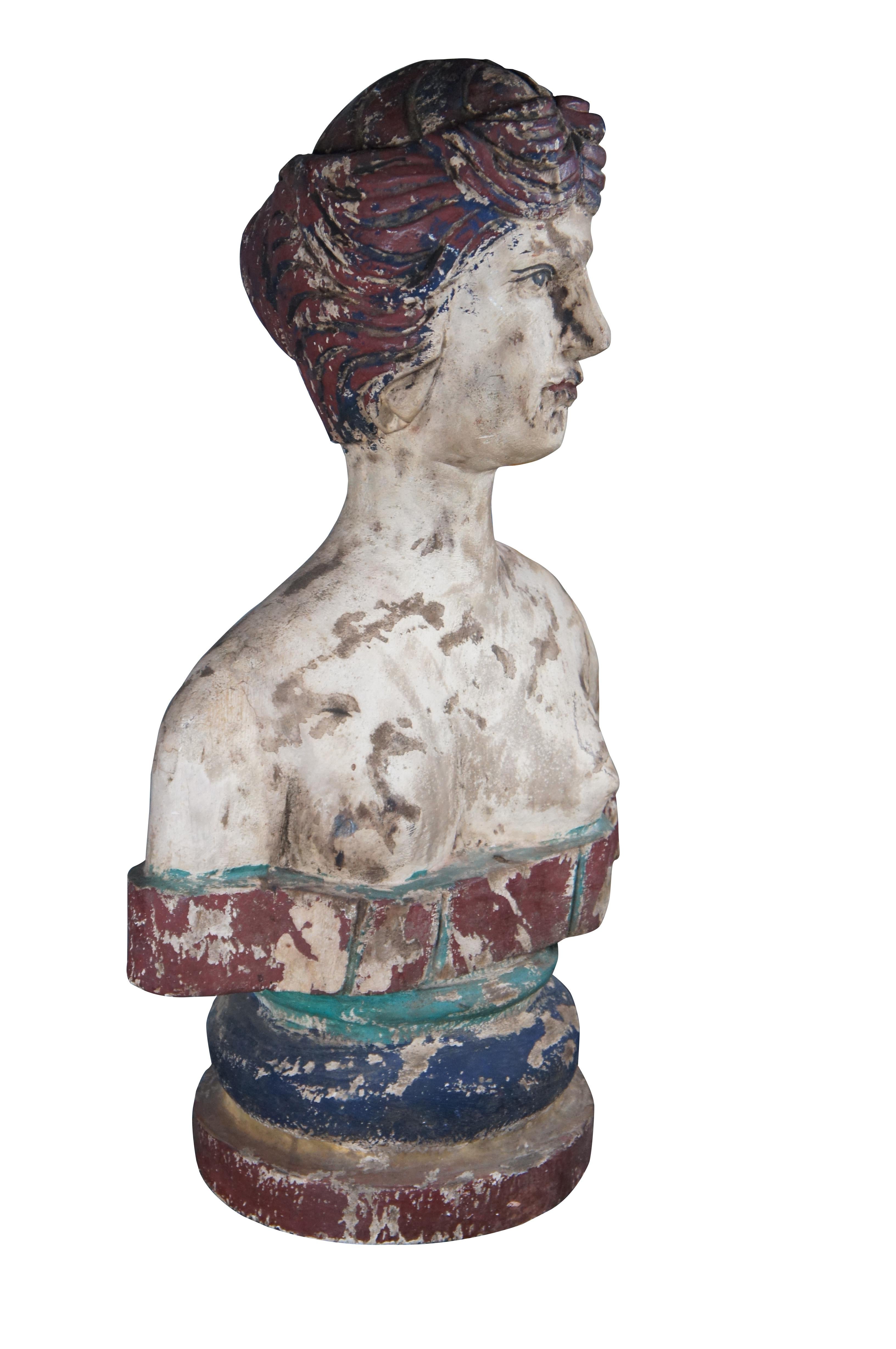 Primitive hand carved polychrome shoulder length bust. Carve from wood with intricate detail and a rustic patina. Great for display on a pedestal or table.

Dimensions:
17