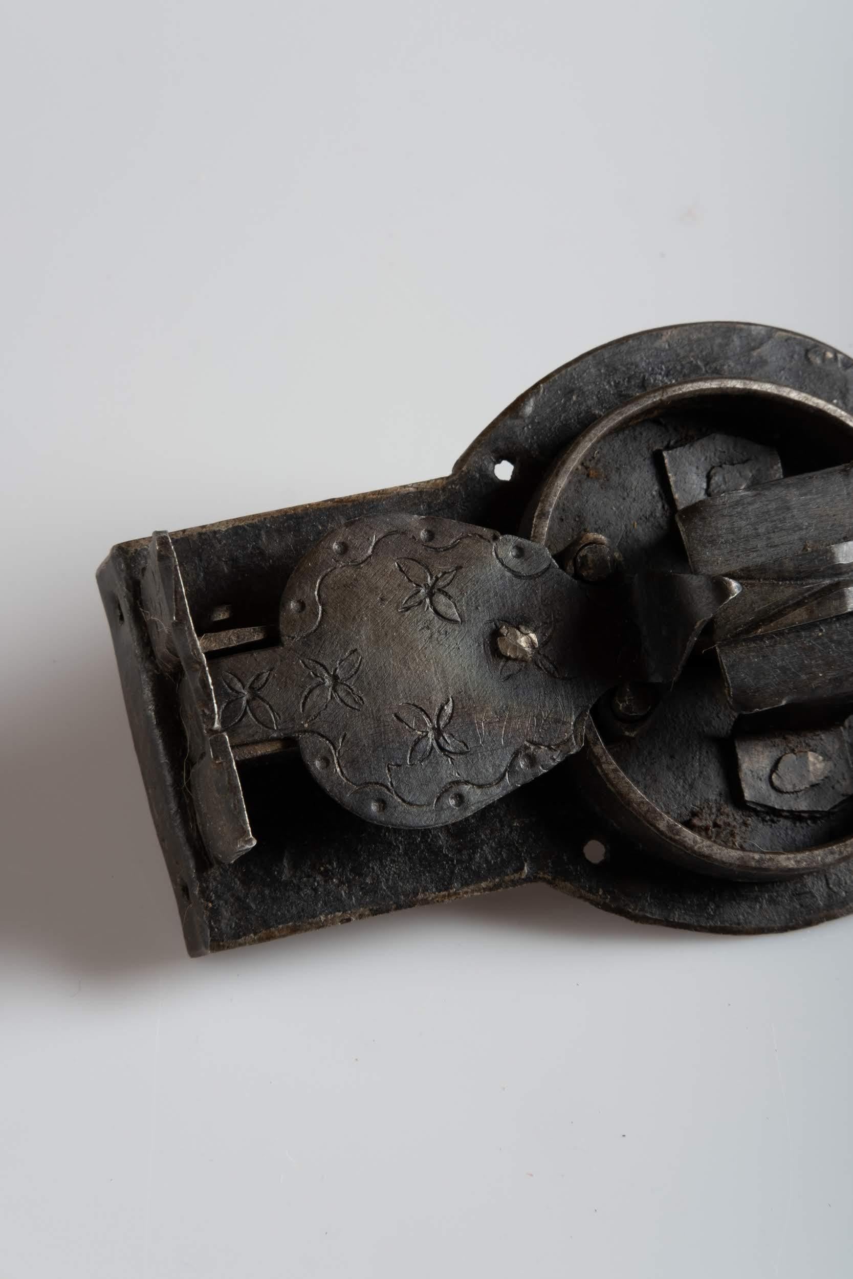 Primitive sculptural handwrought lock.
 