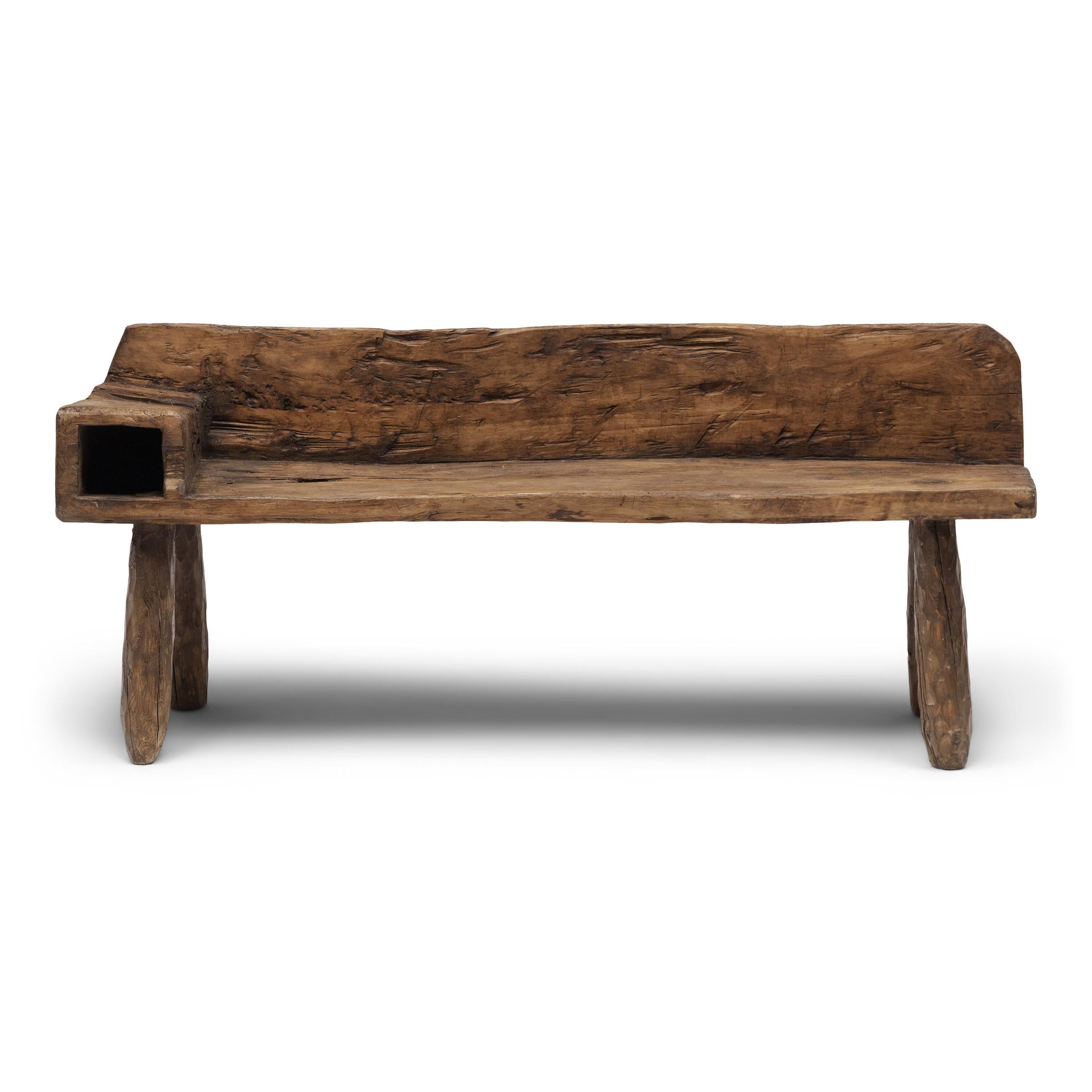 With freeform shape and incredible texture, this low courtyard bench from Shandong province embodies the spirit of wabi-sabi, the Japanese philosophy that beauty and integrity can be found within the imperfections of a timeworn object. The seat and