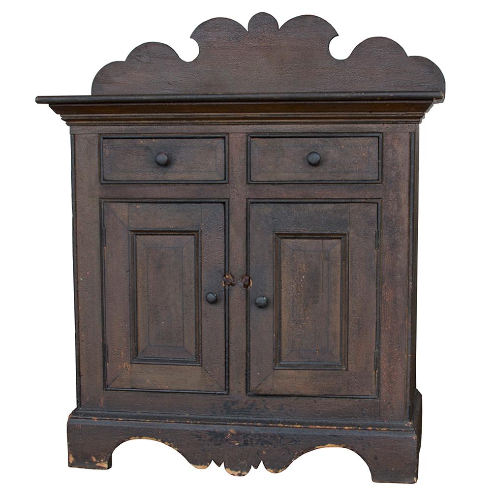 This charming sideboard has beautiful details. The scalloped header and skirt add dimensional flair, while the faux painted sides create even more visual interest in this striking primitive piece.