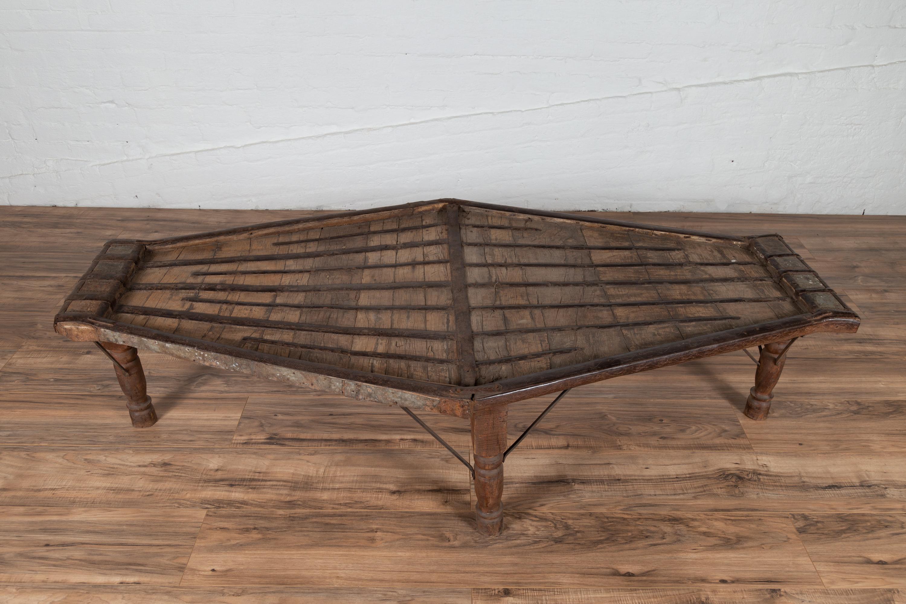 Indian Bullock Cart Coffee Table with Metal Braces and Turned Legs In Fair Condition In Yonkers, NY