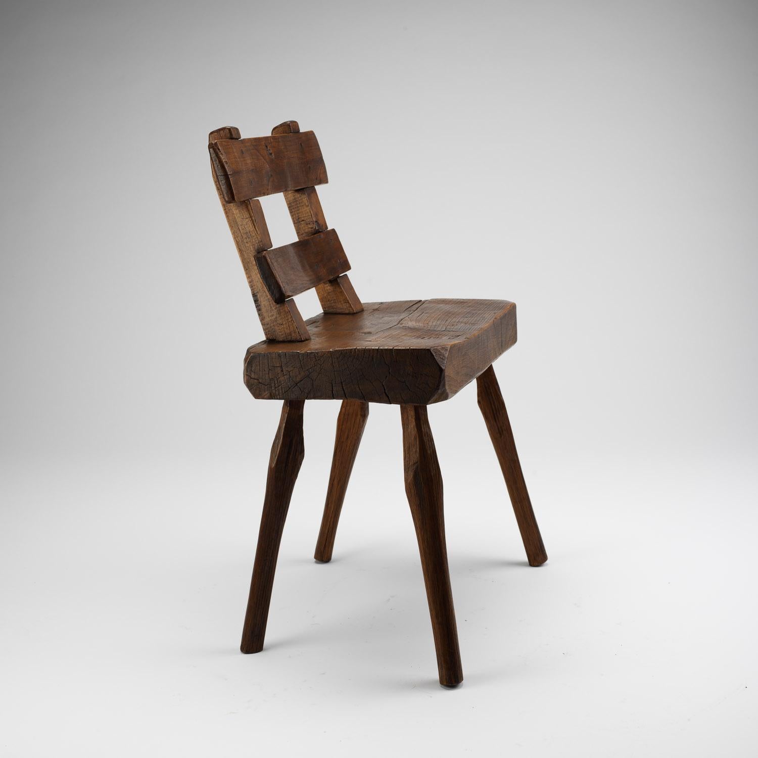 A primitive handmade ladder-back alpine chair in solid ash, France, early 1900s.

         