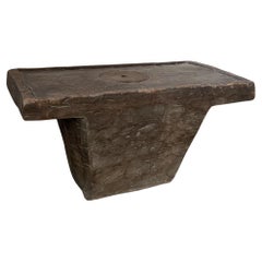 primitive monoxyle wooden mortar sidetable