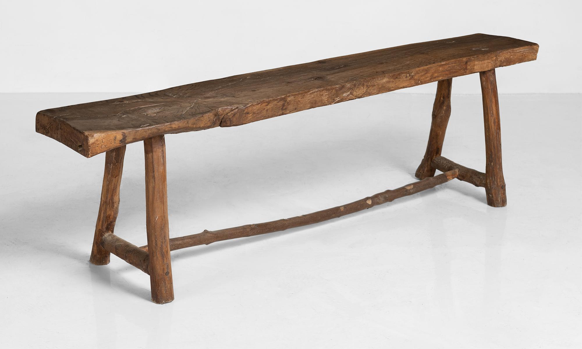 Primitive oak bench, France, 19th century.

Oak slab seat on branch legs with beautiful patina.

Measures: 63” W x 13.5” D x 18” H x 11