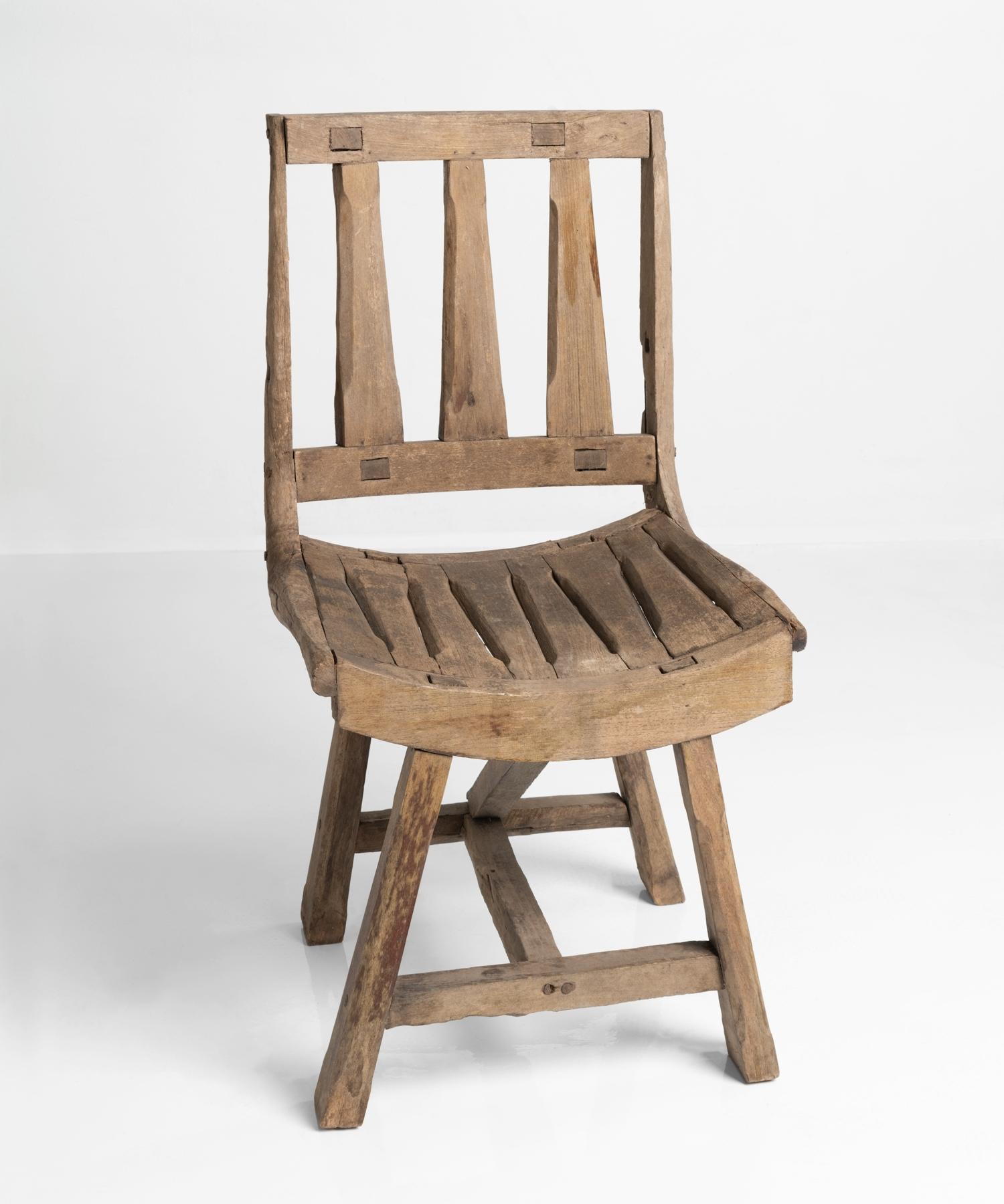 Primitive oak chair, France, 20th century.

Unique form, with handsome pale patina.