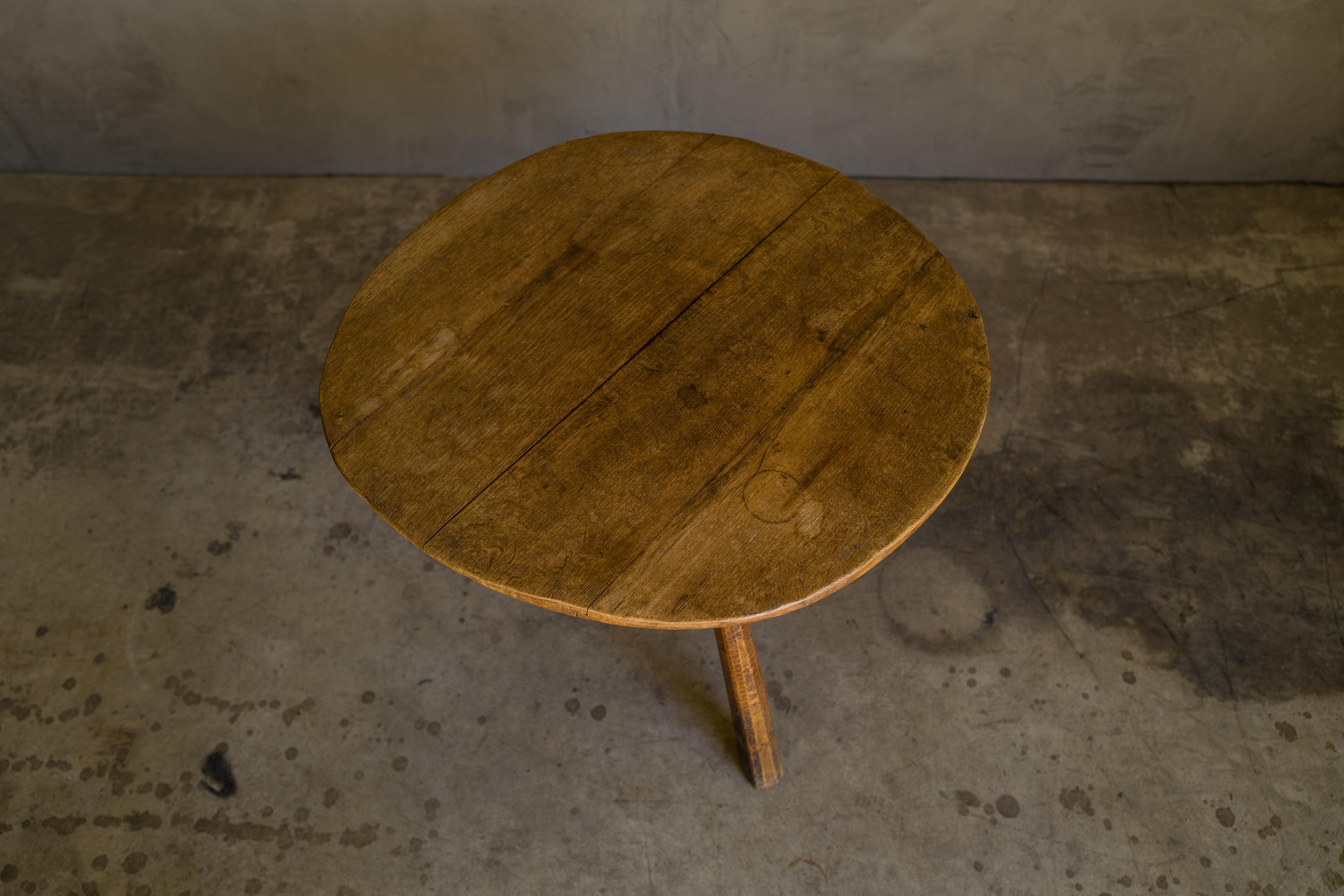 Primitive oak coffee table from France, circa 1950. Unusual model with irregular uneven top. Very nice patina and wear.