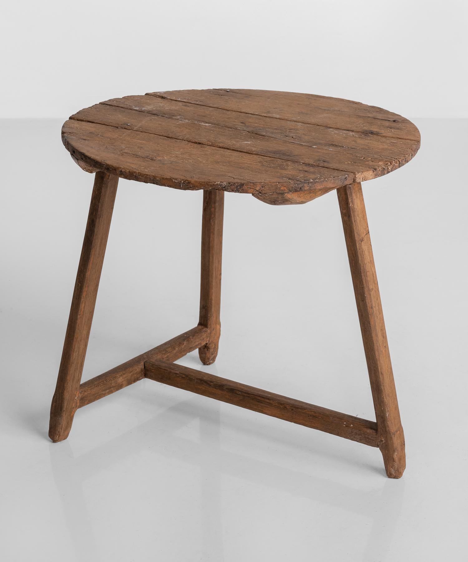 Primitive oak tripod table, made in England, circa 1920.

Unique form with beautiful patina.