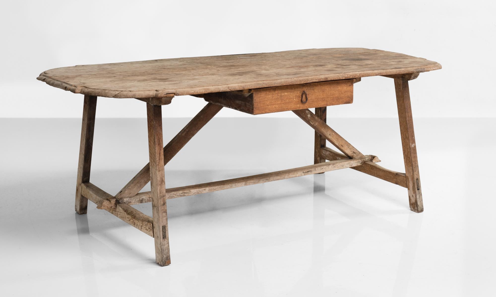 Primitive oval table, Italy, 18th century

Rustic construction with single pull drawer.