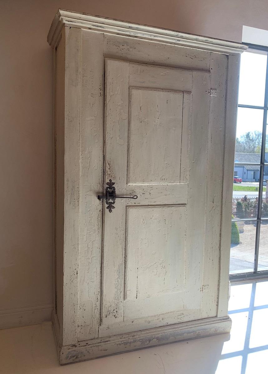 A 19th century Spanish primitive cupboard in chestnut.