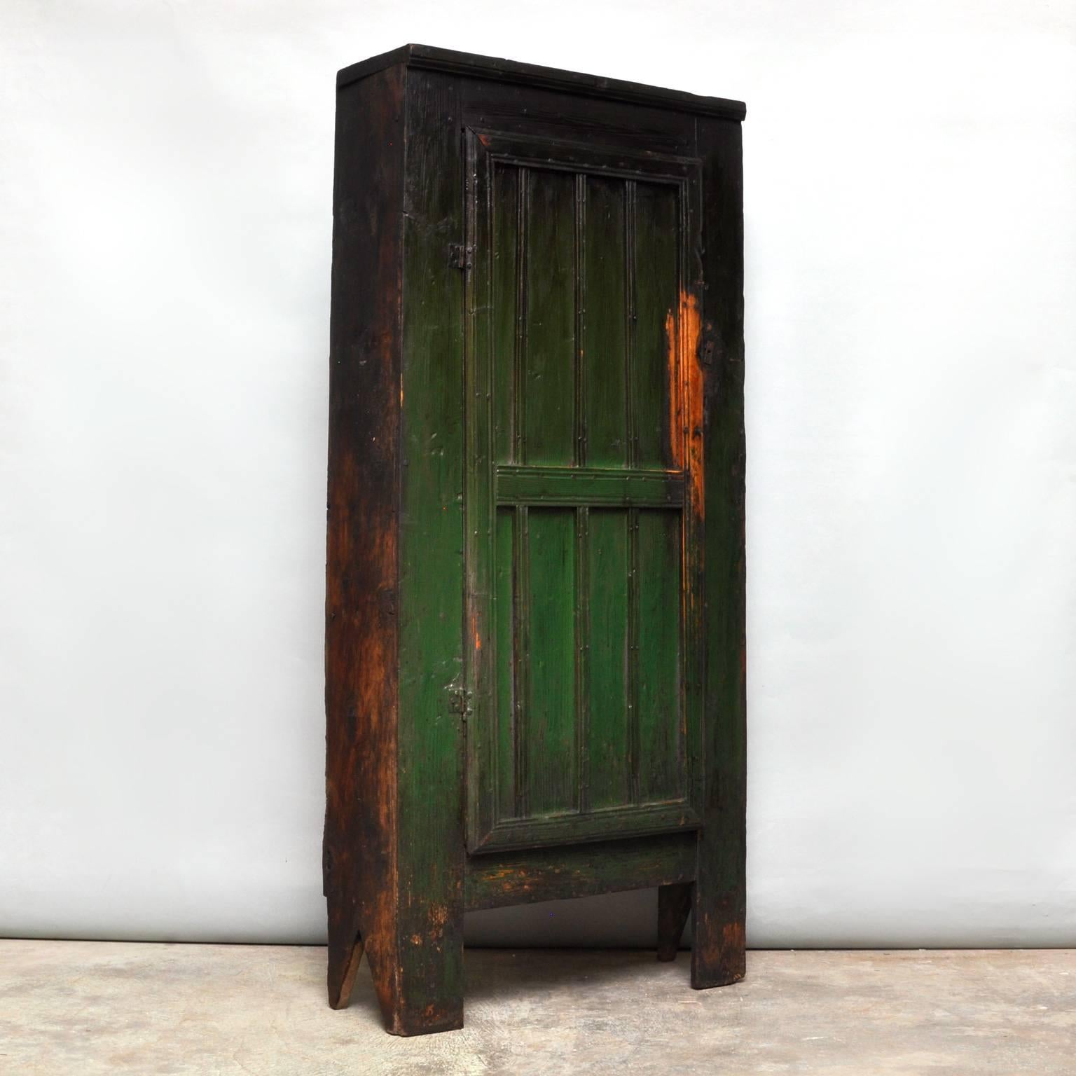 This is a spectacular Primitive cabinet, locally made in Moldavia. Produced circa 1830. Very nice gradient in the green paint. Three shelves. Lock is missing.