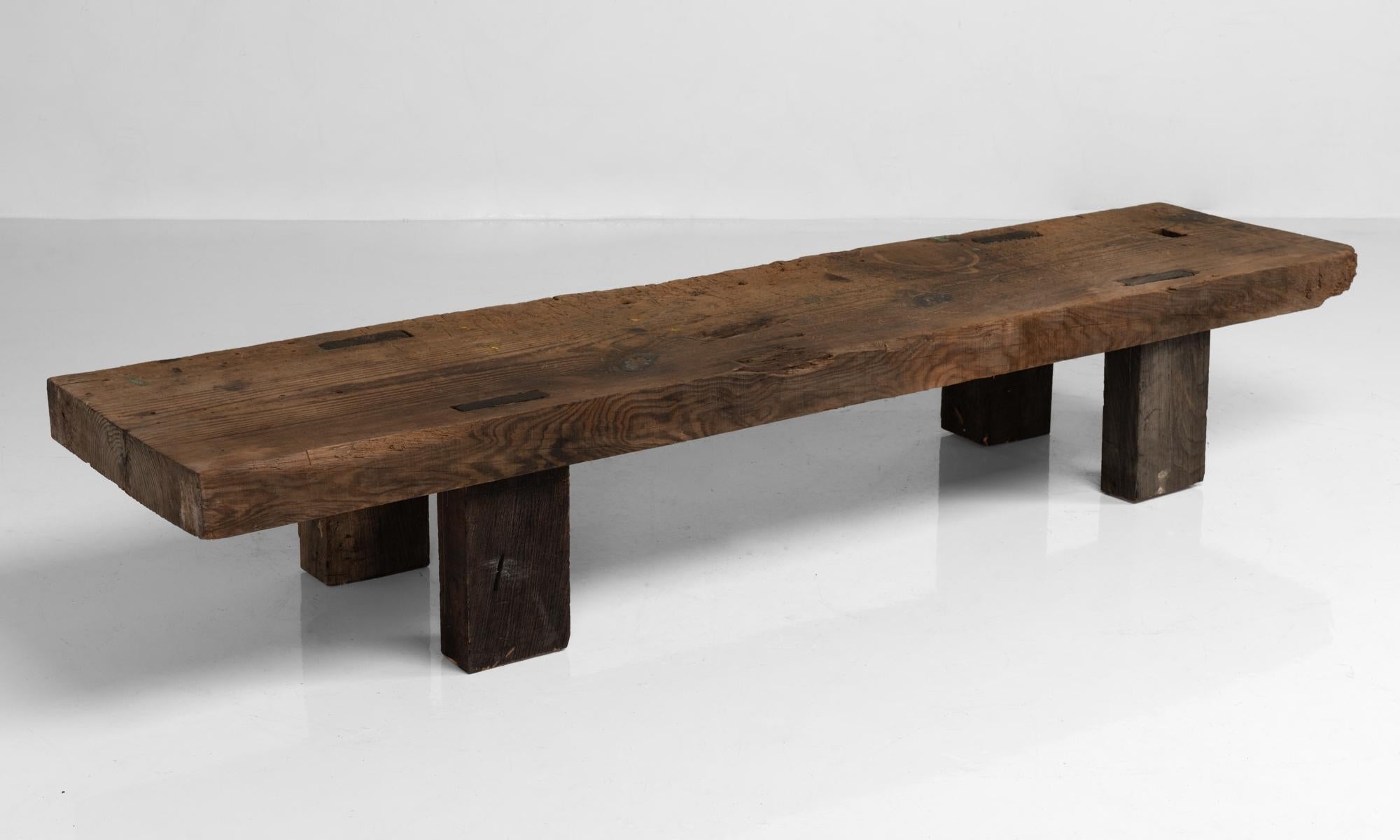 Primitive pine coffee table, France, circa 1900

Thick pine slab top on oak feet with rustic construction.