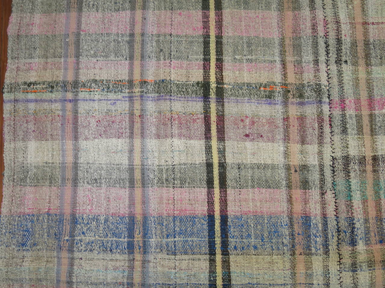 Midcentury Kilim with all-over plaid motif. Light green, pinks, gray, ivory are our favorite colors in this piece

Measures: 6'1