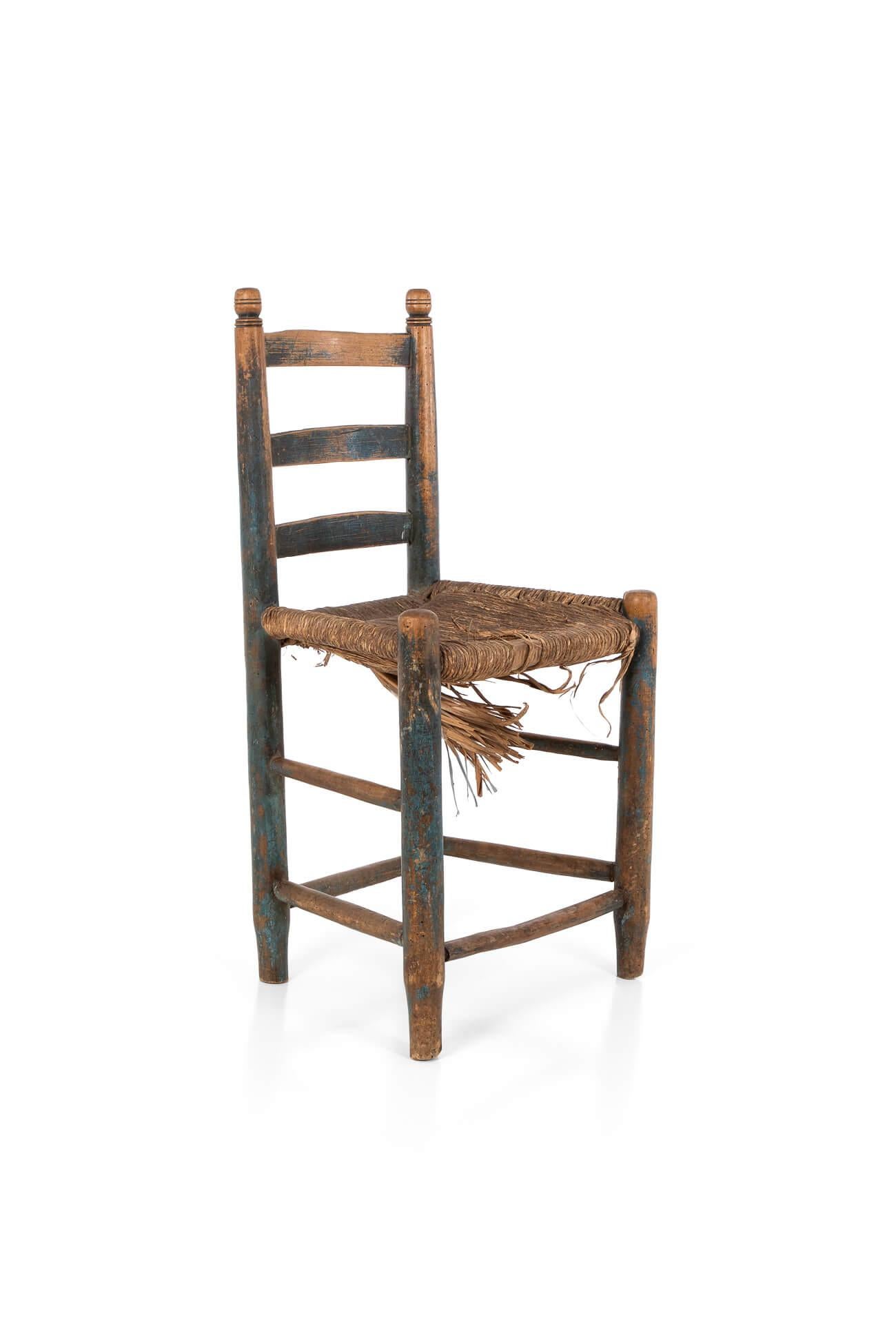 A diminutive rush seat side chair with a ladder back.

Featuring traces of the original blue paint to the legs.

English, circa 1890.

TOTAL

H: 84 CM  H: 33 INCHES

W: 45 CM  W: 17.7 INCHES

D: 34 CM  D: 13.3 INCHES

SEAT HEIGHT

H: 46 CM  H: 18.1