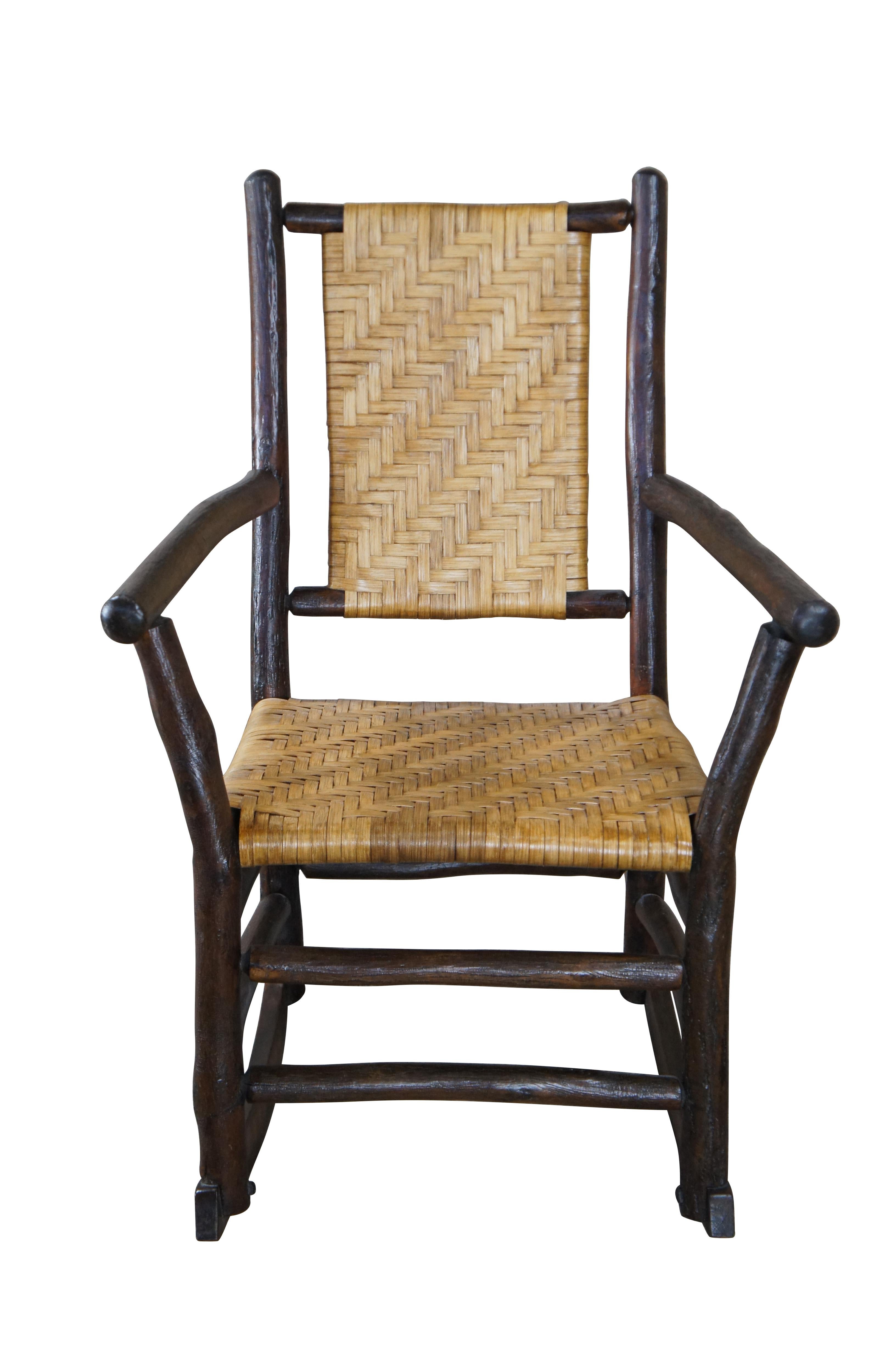 Primitive Rustic Adirondack lodge chair.  Handmade from hickory with woven seat and back.  

Dimensions:
24