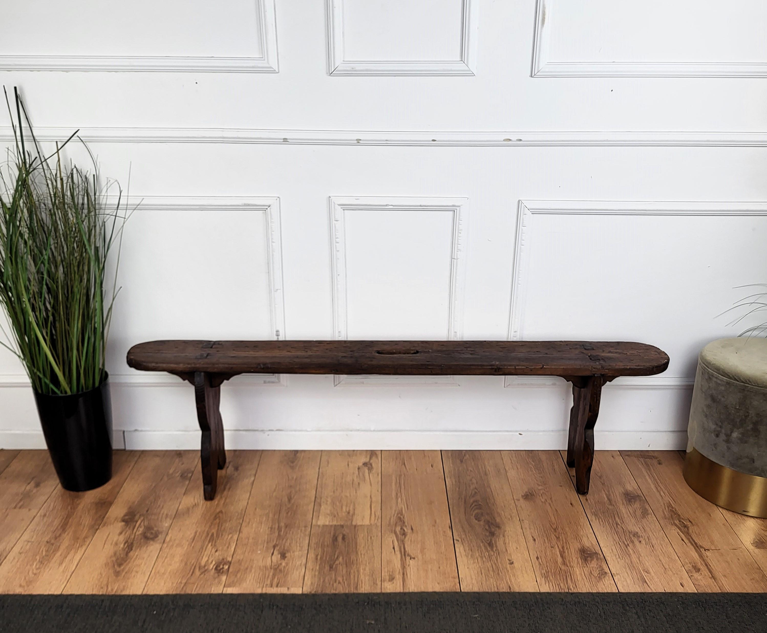 Beautiful Italian rustic primitive country wooden bench, with trestle style legs in original aged natural color giving the rich and beautiful patina that makes it look wonderful in every interior.

Solid wood constructions, beautiful wood grain,