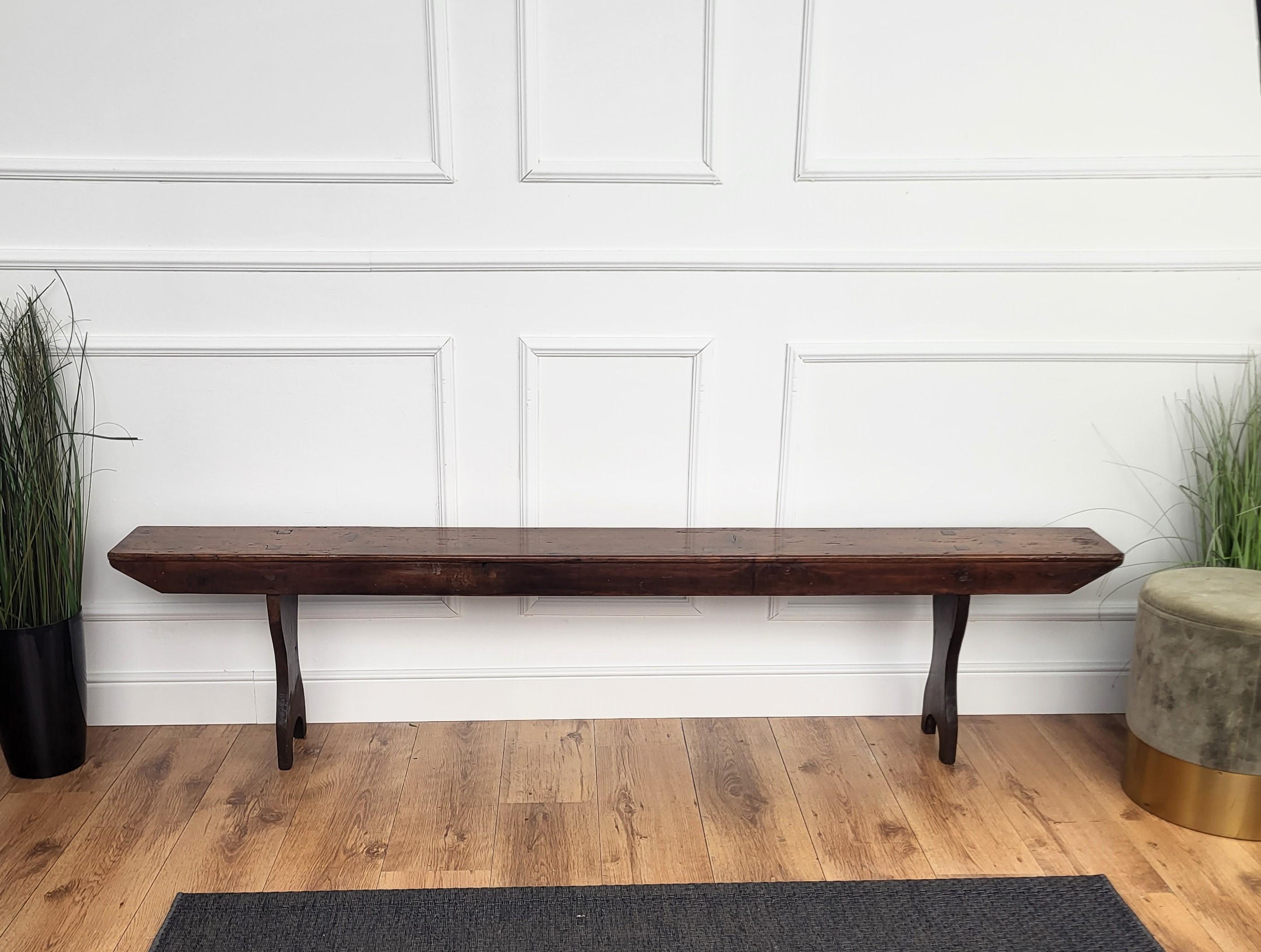Beautiful Italian rustic primitive country wooden bench, with trestle style legs in original aged natural color giving the rich and beautiful patina that makes it look wonderful in every interior.

Solid wood constructions, beautiful wood grain,