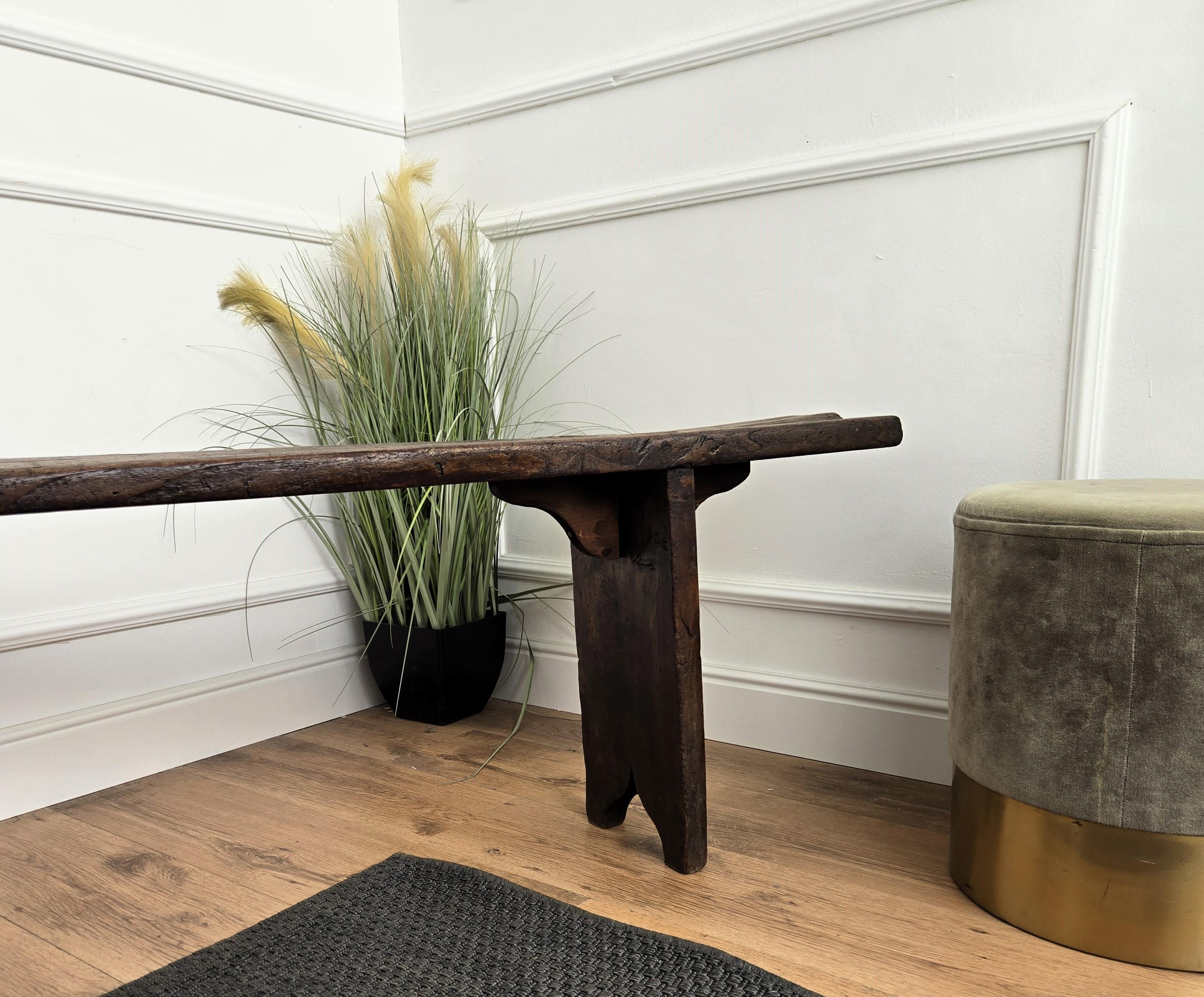 Beautiful Italian rustic primitive country wooden bench, with trestle style legs in original aged natural color giving the rich and beautiful patina that makes it look wonderful in every interior.

Solid wood constructions, beautiful wood grain,