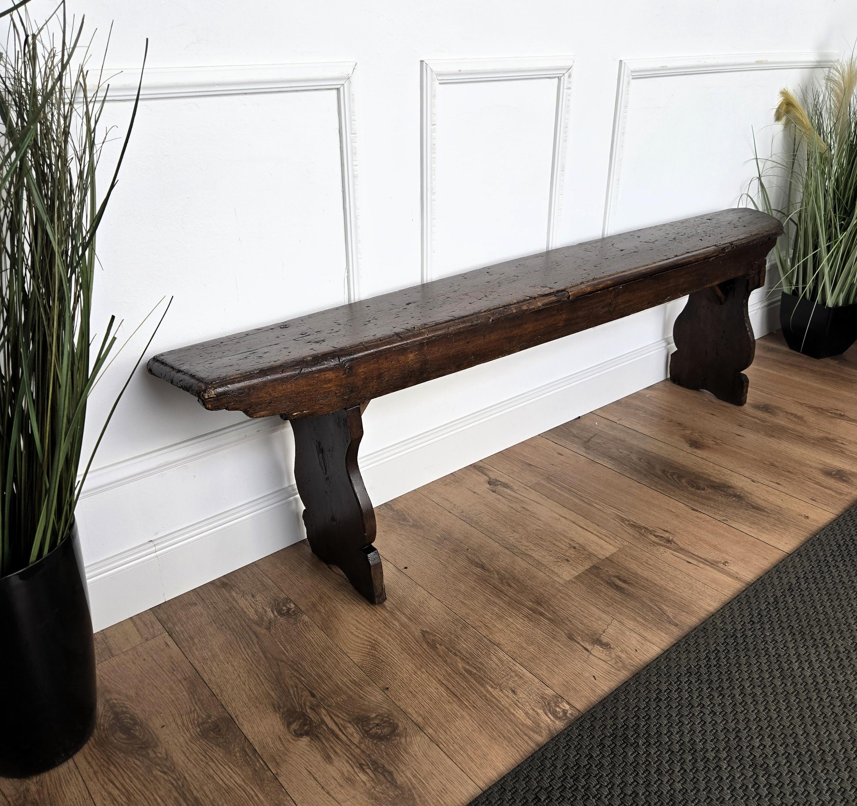 Beautiful Italian rustic primitive country wooden bench, with trestle style legs in original aged natural color giving the rich and beautiful patina that makes it look wonderful in every interior.

Solid wood constructions, beautiful wood grain,