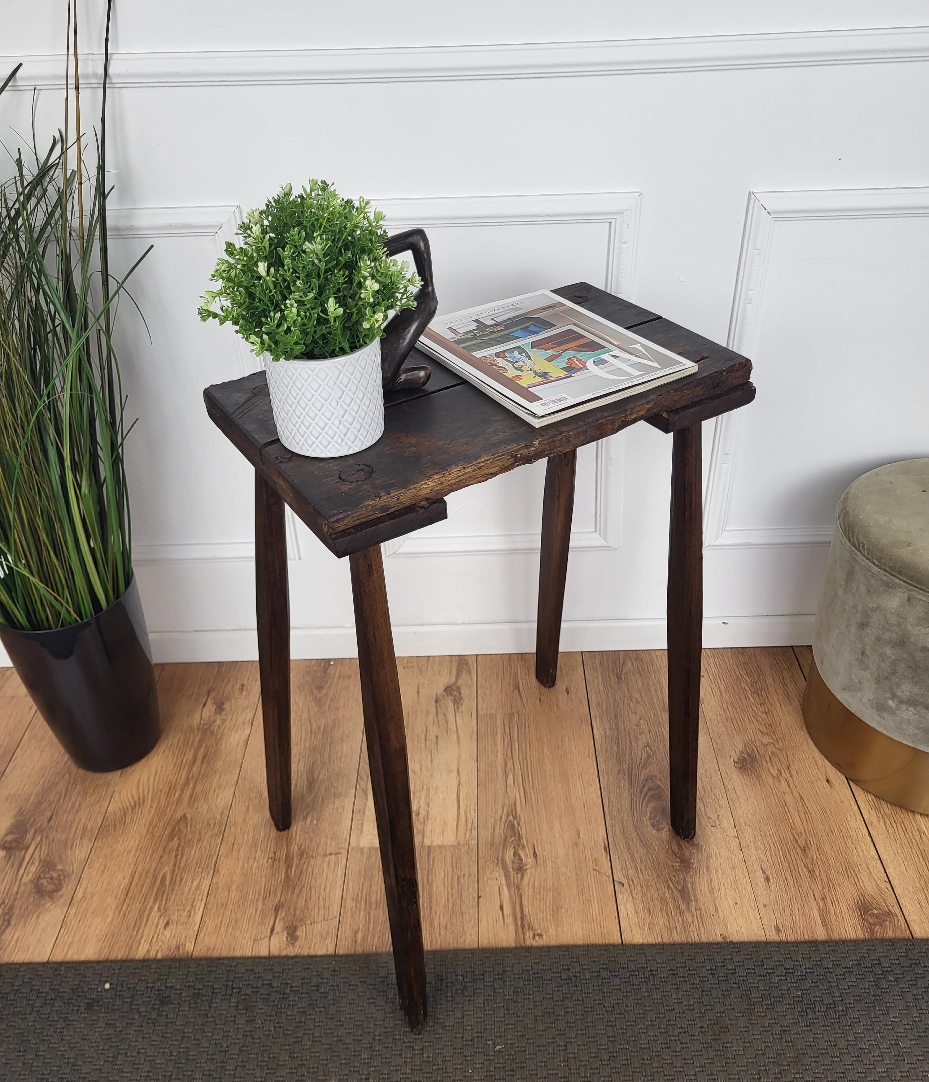 Beautiful Italian rustic primitive country wooden table, with typical legs in original aged natural color giving the rich and beautiful patina that makes it look wonderful in every interior. This piece is in the rustic primitive spirit of organic