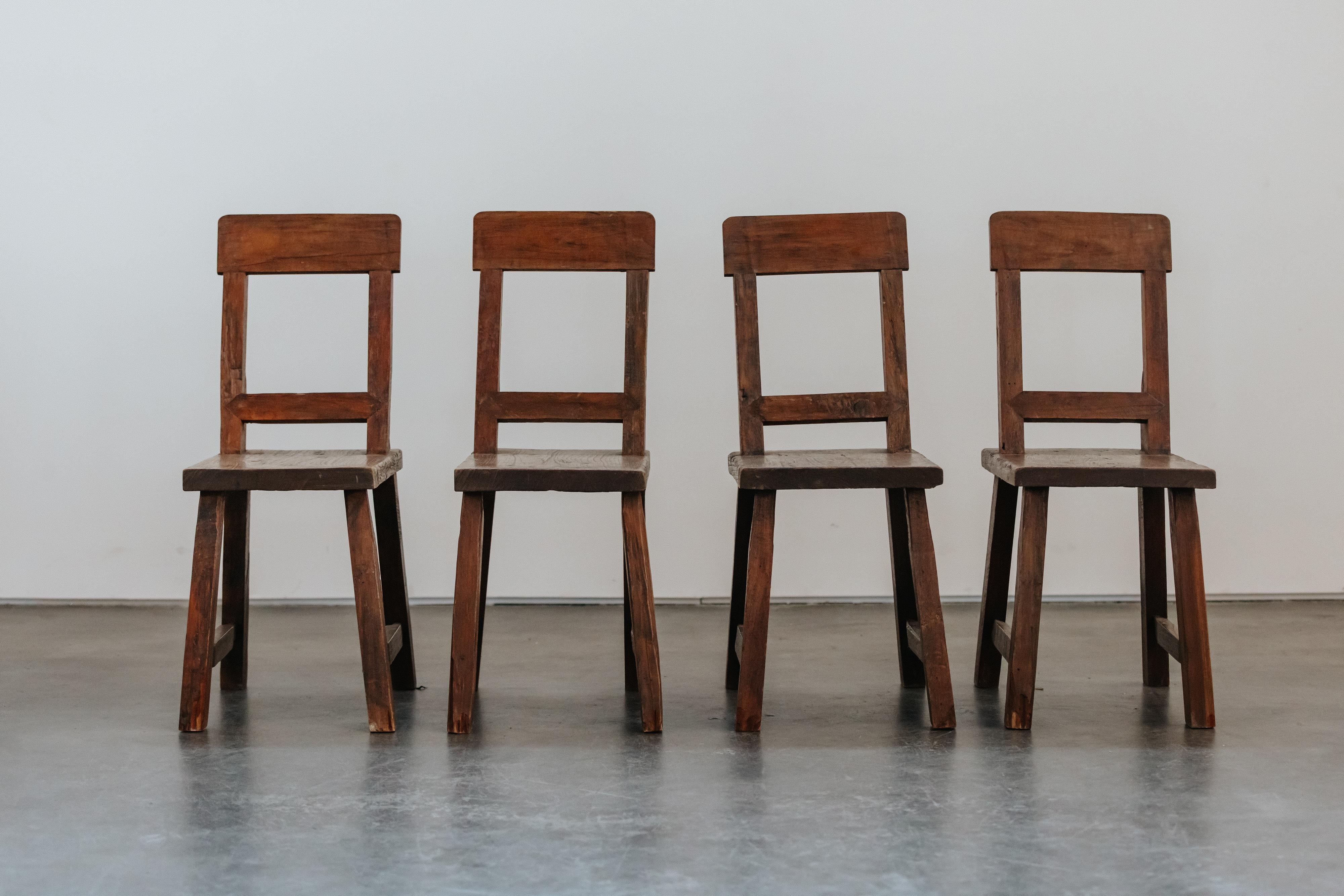 Primitive Set OF Four Chairs From France, Circa 1880.  Solid oak construction with excellent patina and use.
