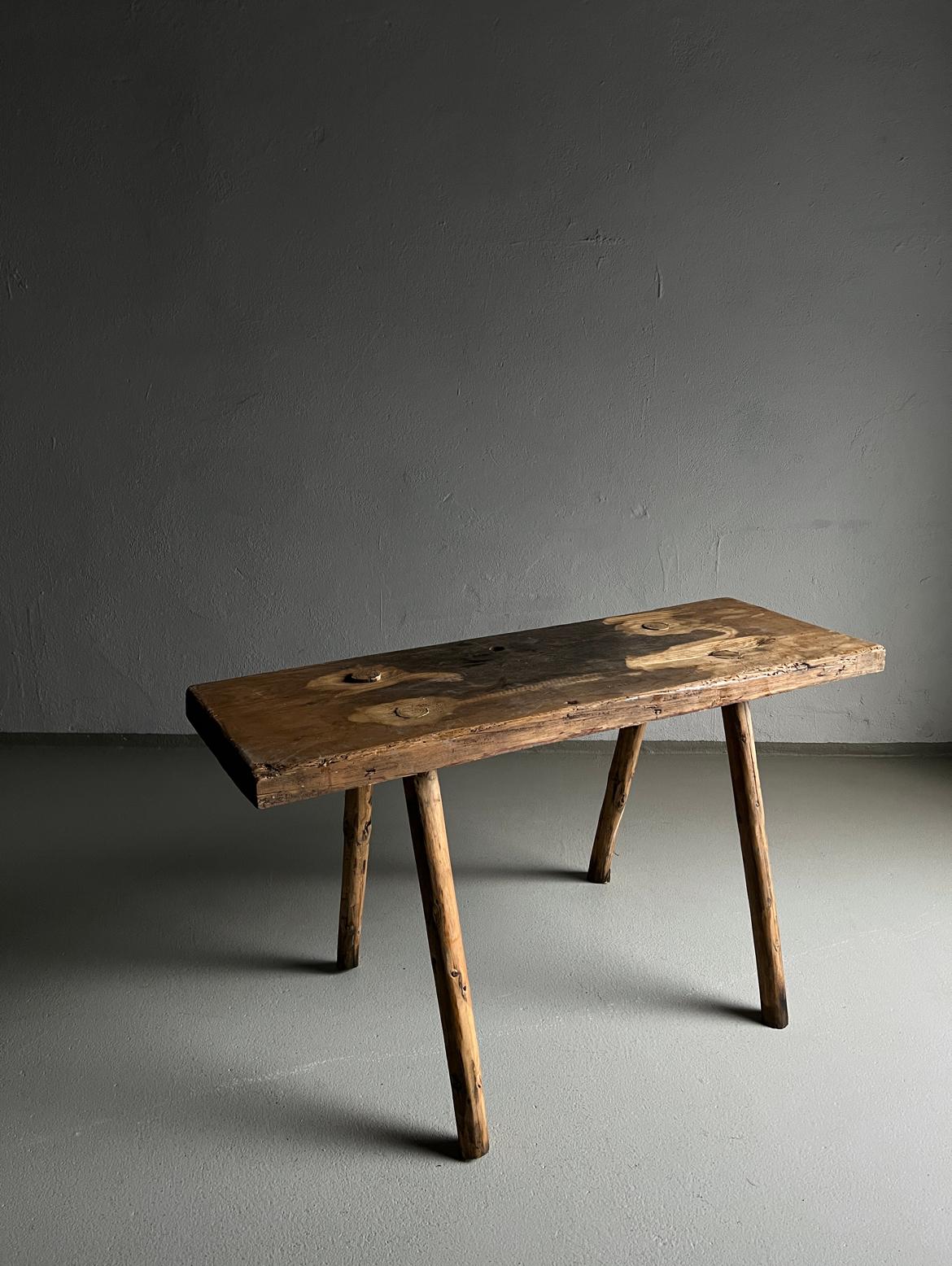 Rustic carved wood bench or side table with a beautiful patina.