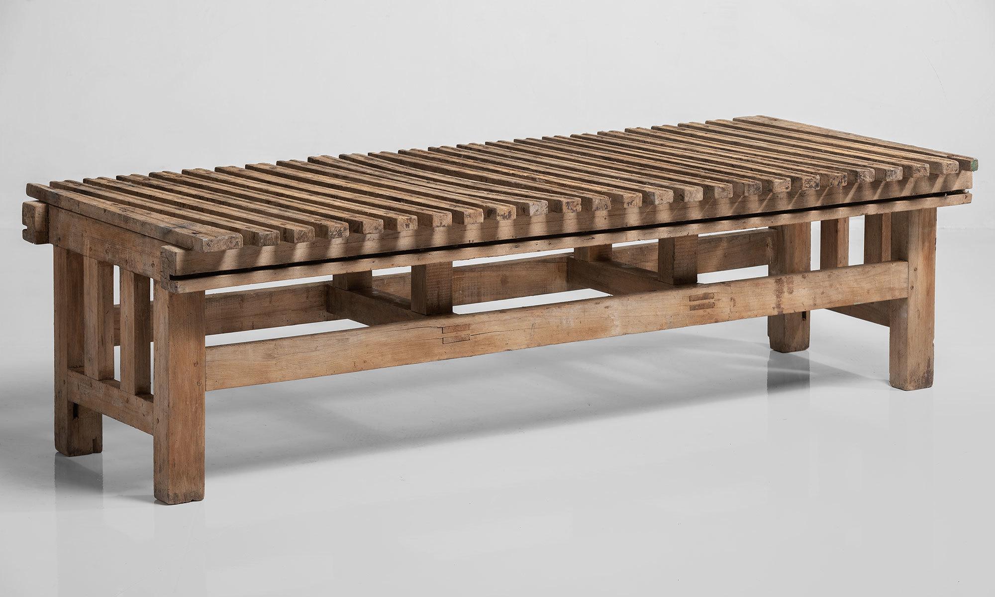 Primitive slatted coffee table, Italy, circa 1890.

Substantial construction and in an amazing patina with slats that run at a slight diagonal.