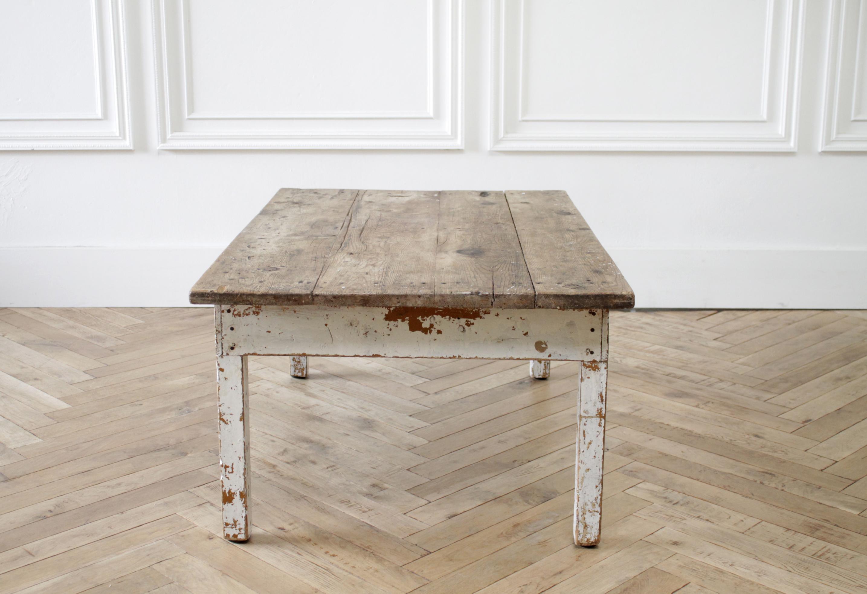 Primitive style farmhouse coffee table with natural wood top
Original white chippy painted base, and natural European pine wood top.
Solid and sturdy ready for everyday use.
Size: 43.5