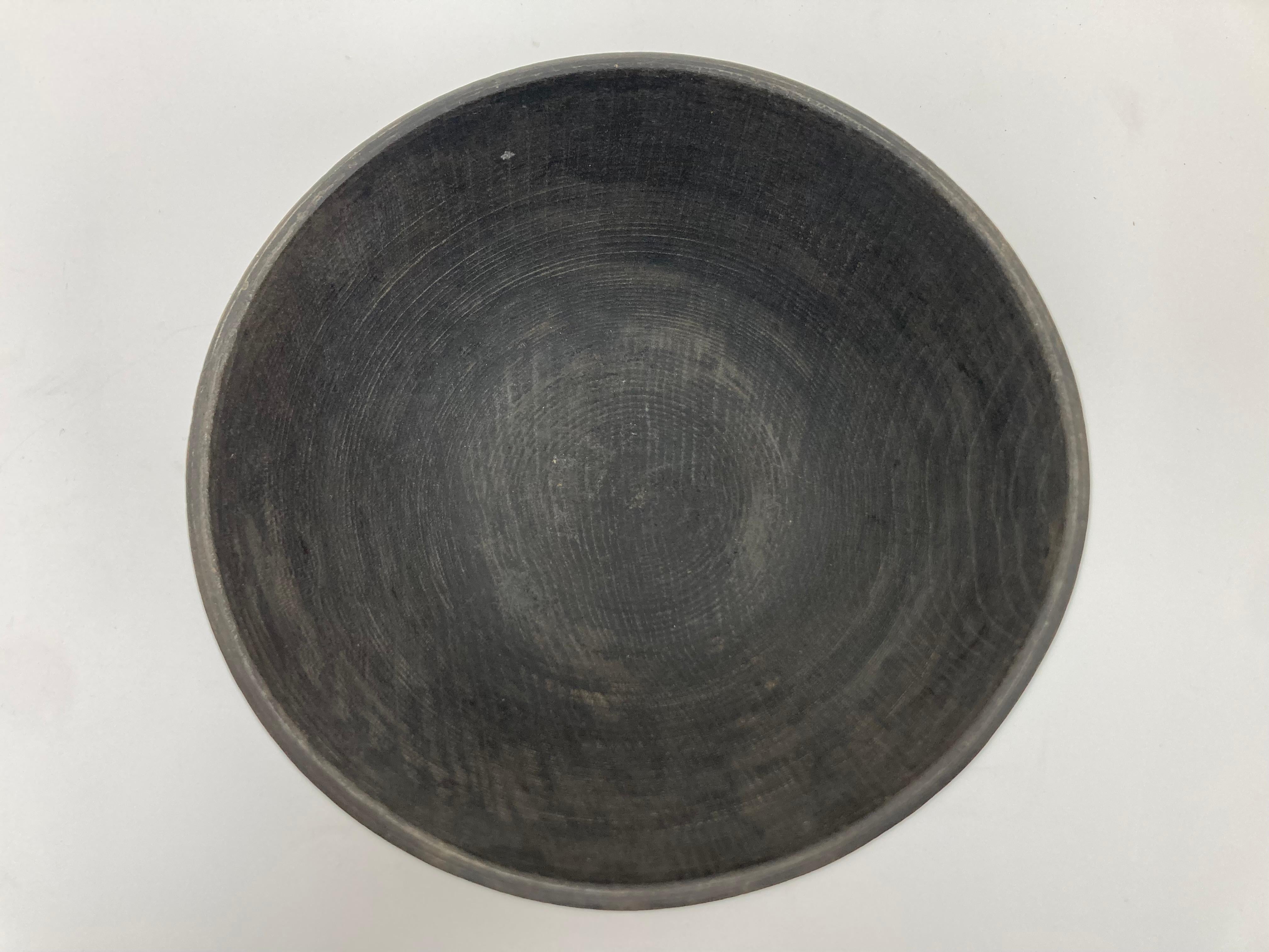 Primitive Style Turned and Footed Wood Bowl In Fair Condition For Sale In Bridgeport, CT