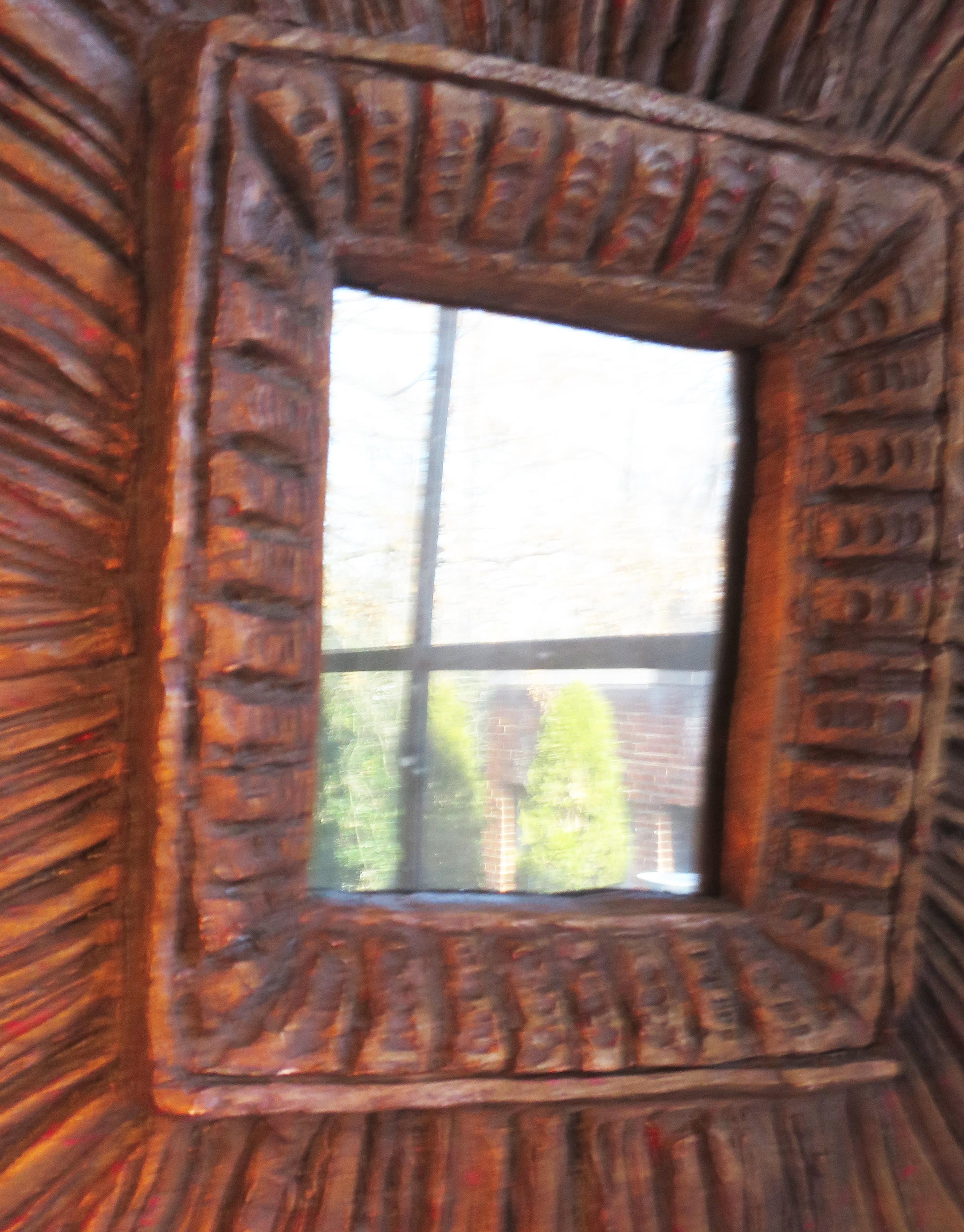 A primitive version of a sunburst mirror. Made of resin. Heavy. Good presence.
Signed and dated 