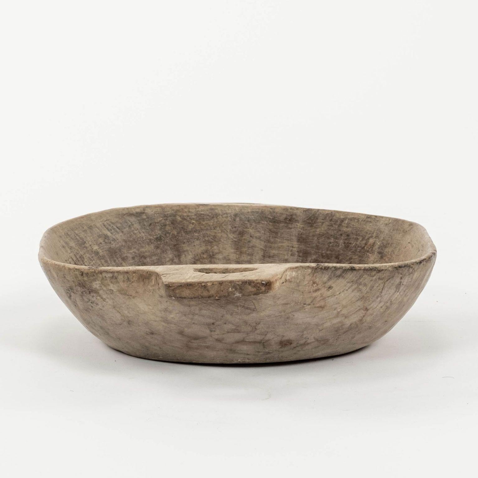 Primitive Swedish Lapland bowl with handles. Dry-rubbed mid-brown finish. Hand-carved in sycamore. Dates to early 19th century or late 18th century.

Note: Due to regional changes in humidity and climate during shipping, antique wood may shrink