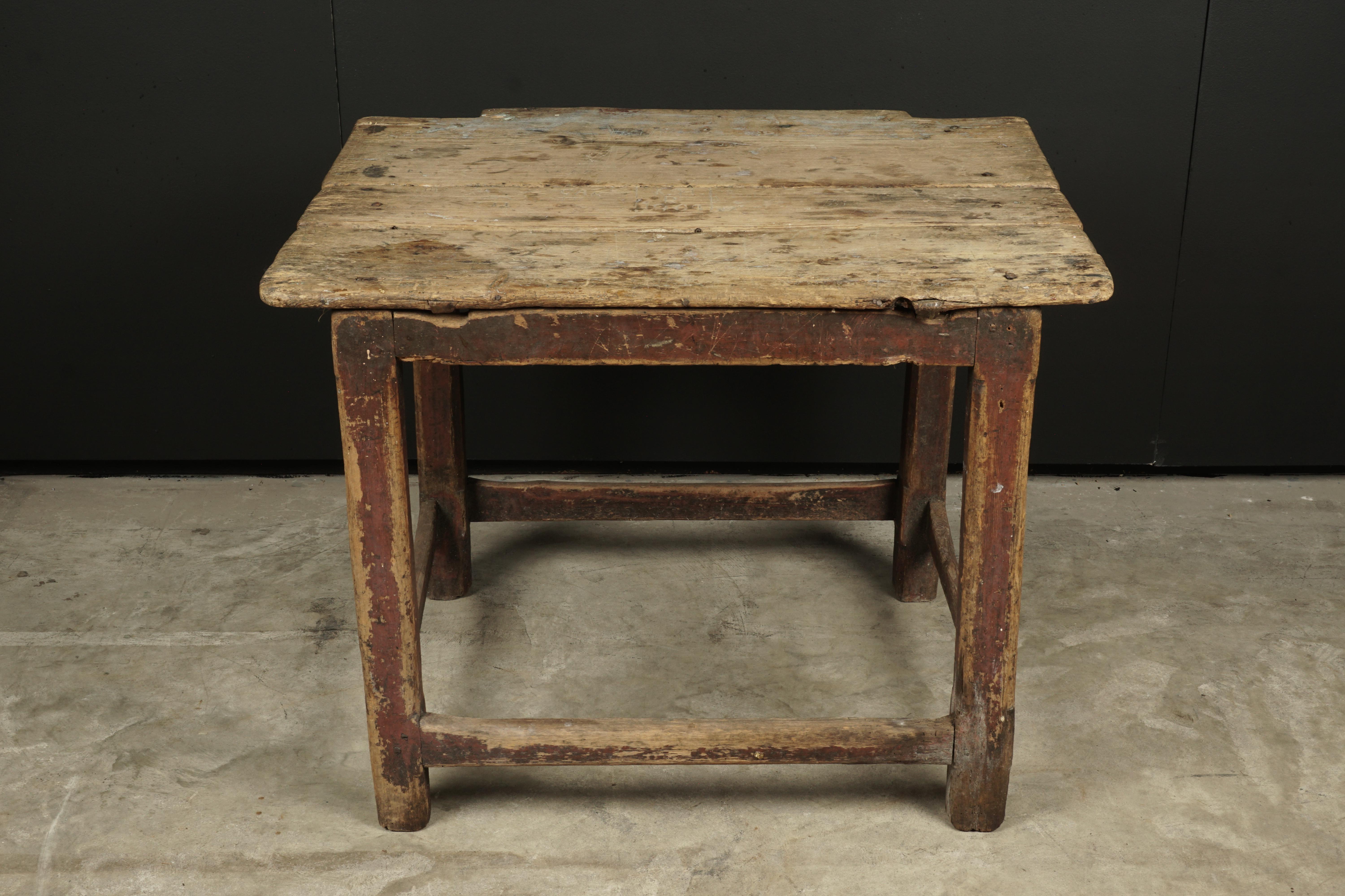 Early Primitive table from Sweden, circa 1850. Solid pine construction with great original color and patina. Top with nice graffiti.